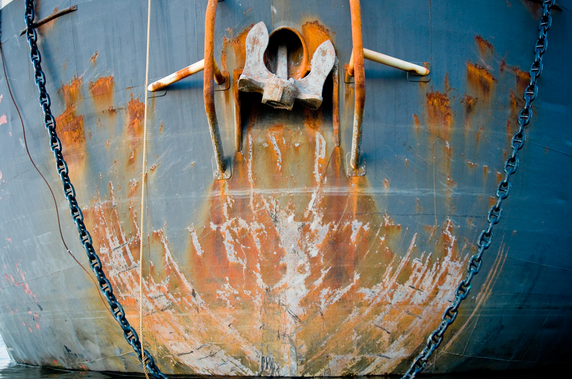 Bow, anchor, and towing chains of a barge docked at Domino Sugar