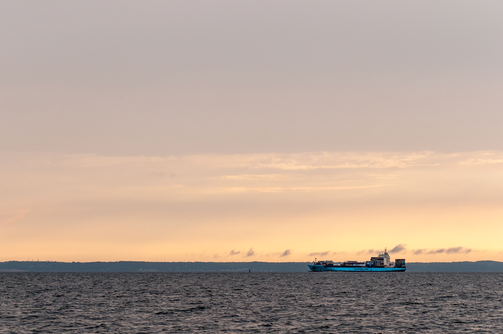 JUNE 13, 2014 - Chesapeake Bay, MD, USA - A blue Maersk LIne container ship heads south down Chesapeake Bay at sunset - taken from onboard S/V Raekved during a delivery from the Florida Keys to Annapolis, MD. - IMAGE © 2014 Andy Herbick | www.andyherbickphotography.com - ALL RIGHTS RESERVED.
