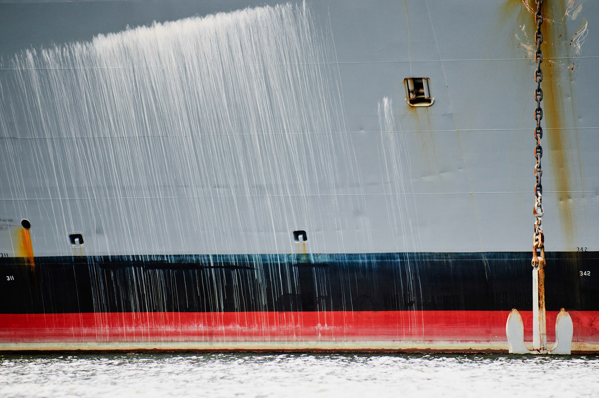 Hull and anchor of the U.S. Naval Ship "Denebola" docked at Pier 10 of the North Locust Point Marine Terminal