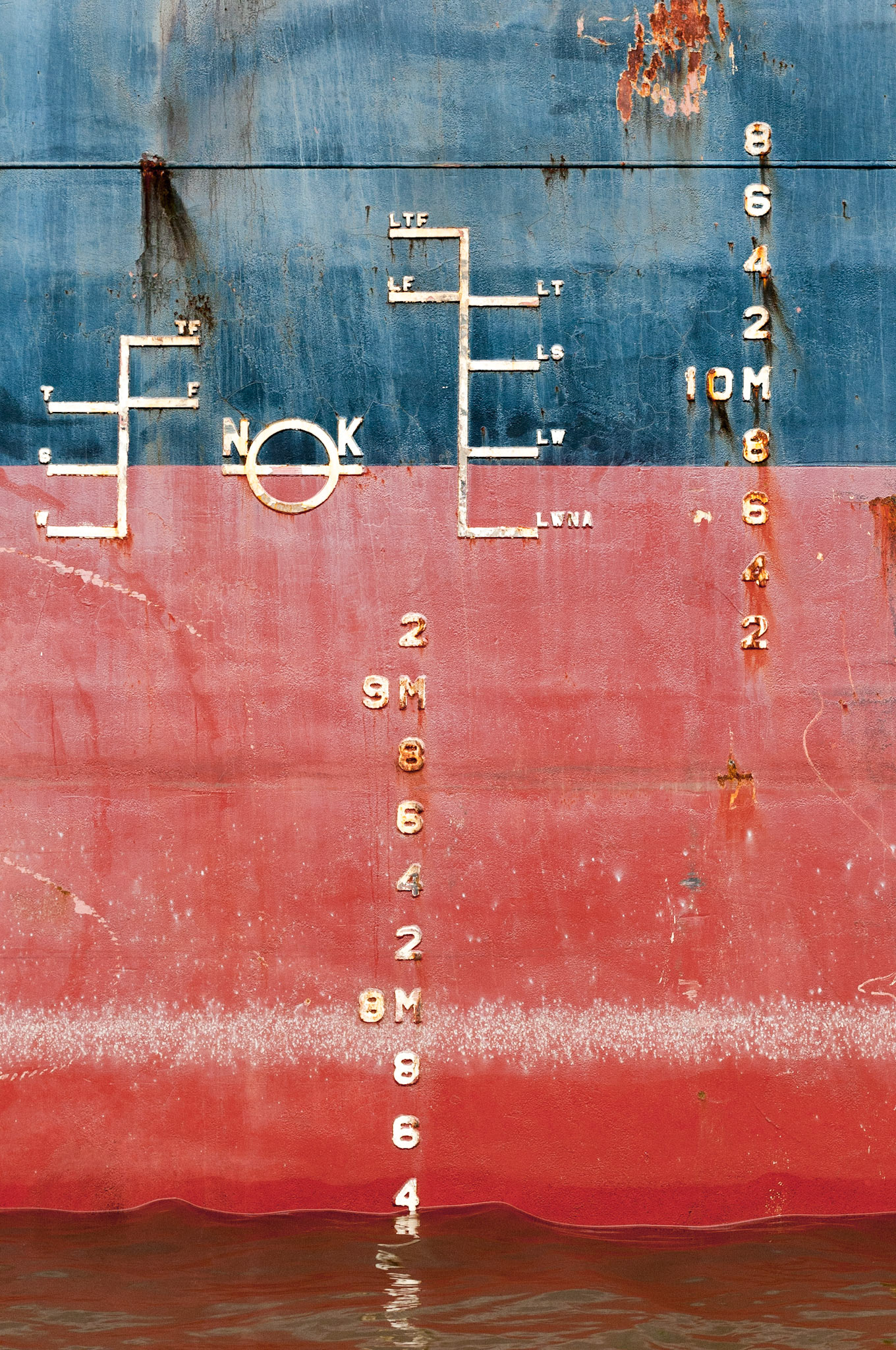 nk - inner harbor - baltimore, md - 2016 | a new one for the "rust &amp; cranes" collection | markings and rust on the hull of the cargo ship  "Laser Ace" while offloading at Domino Sugar