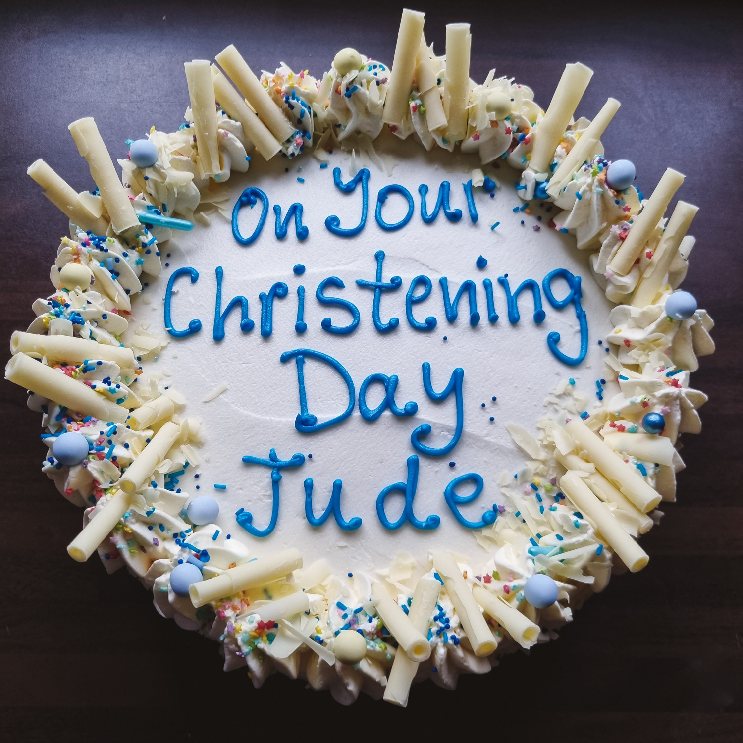 Christening Cream cake with strawberries, blue writing