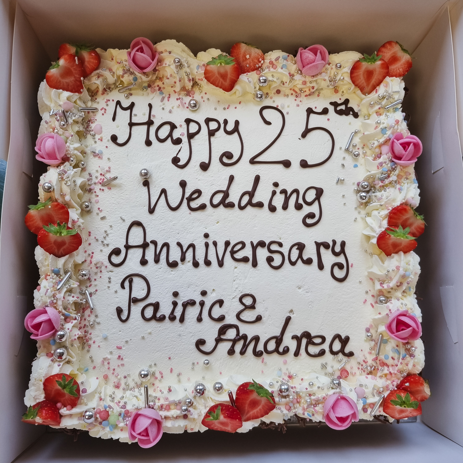 Cream and Strawberries Anniversary cake with message