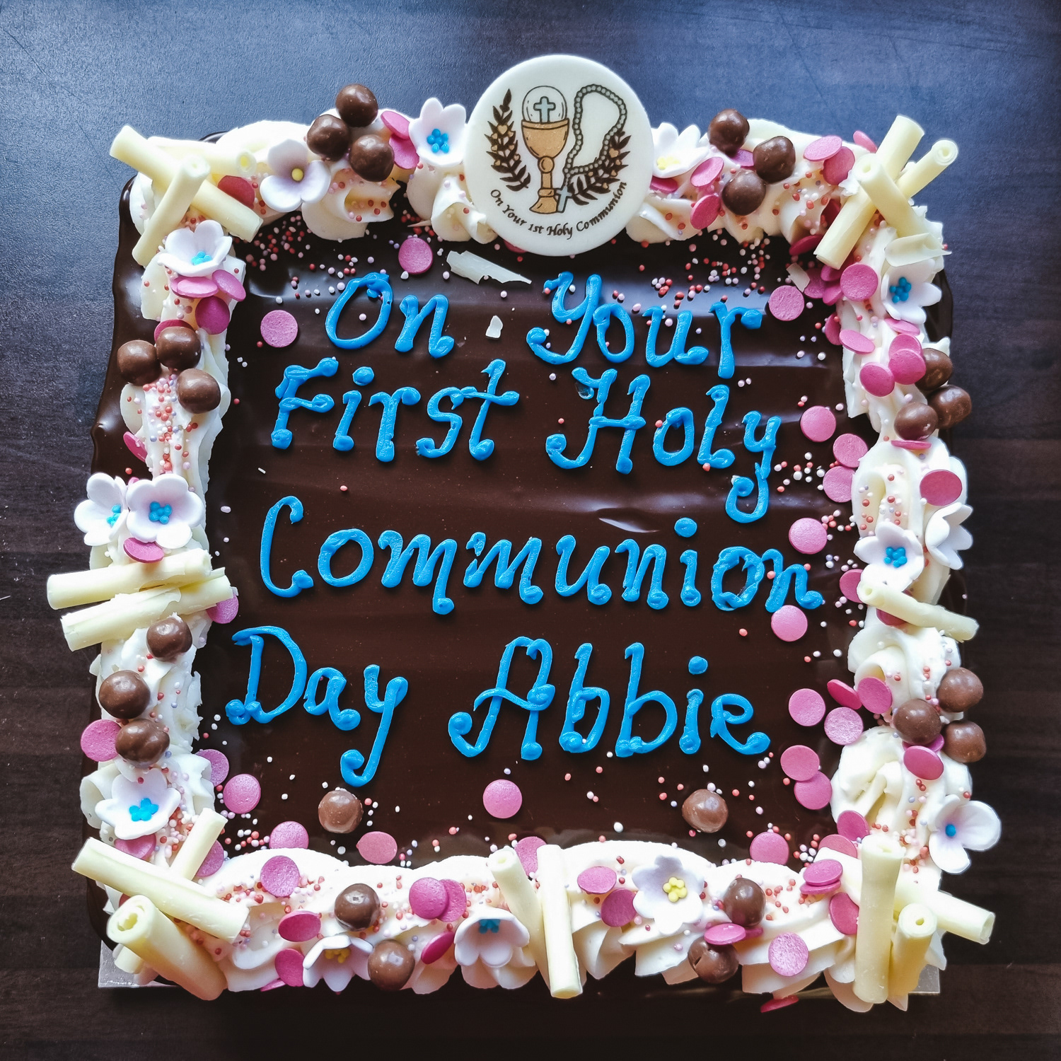 Chocolate fudge Communion cake with message in blue