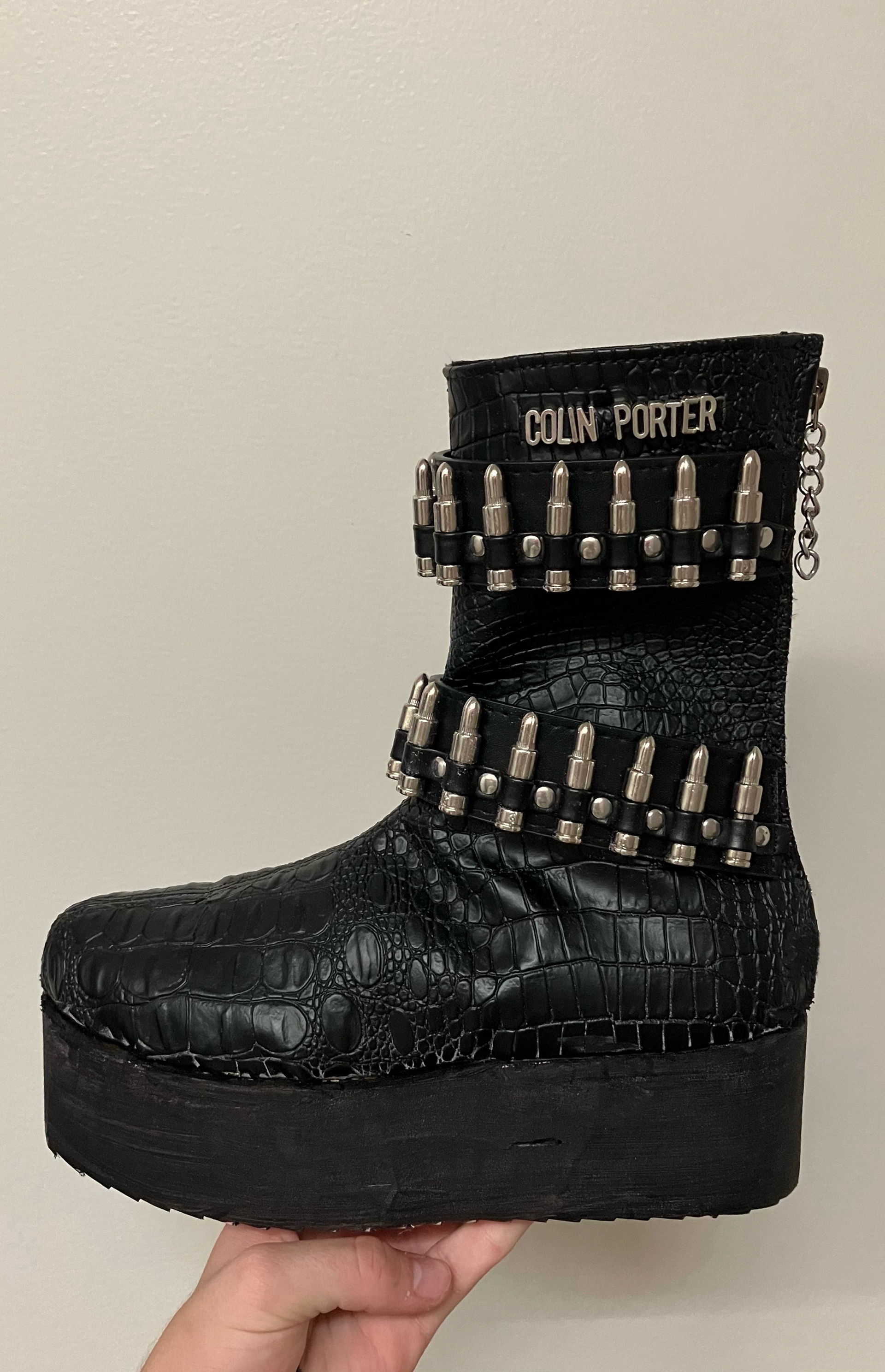 Embossed exotic leather boot with fake bullet appliqué