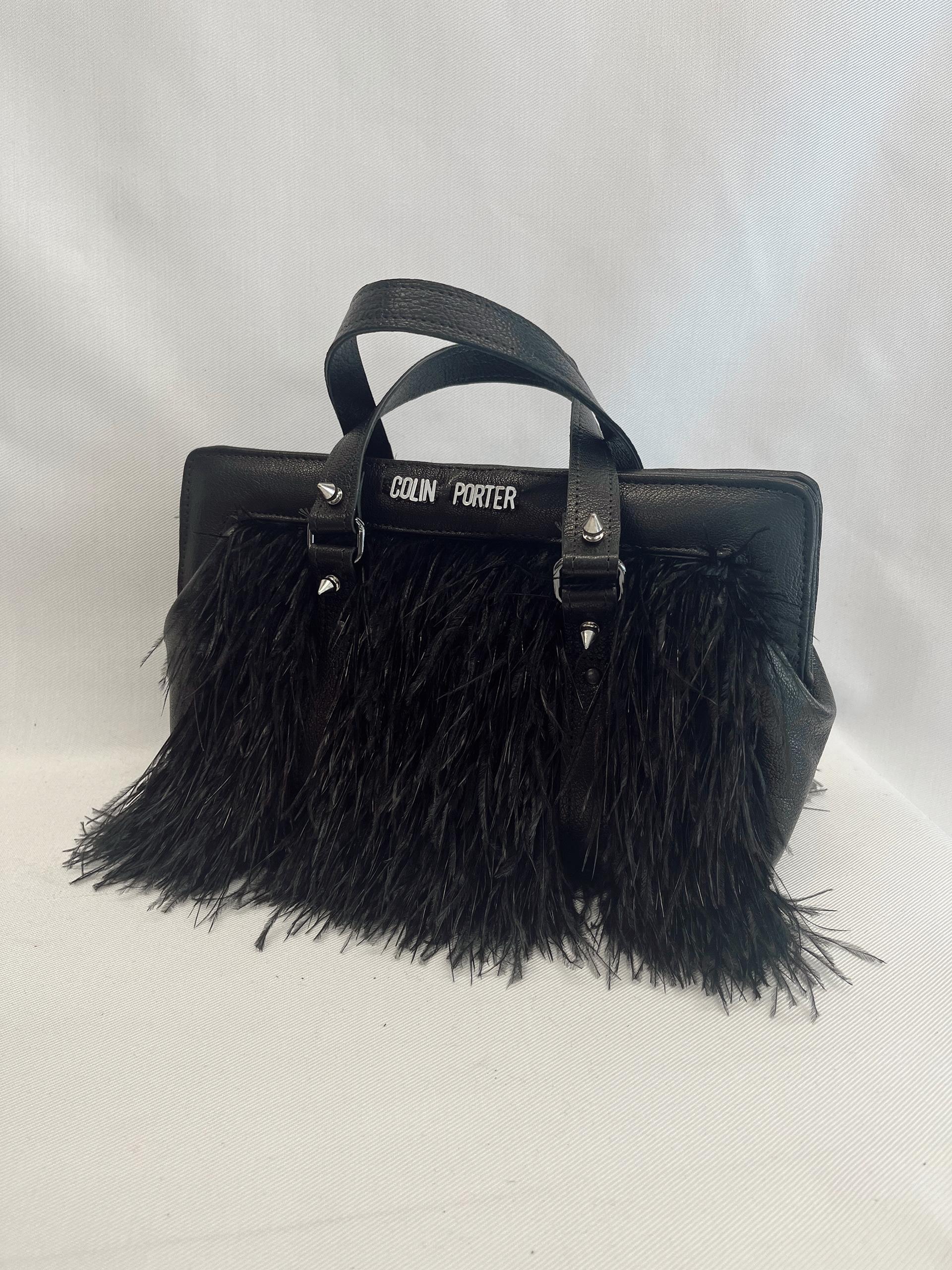 Frame bag made with natural Ostrich feathers