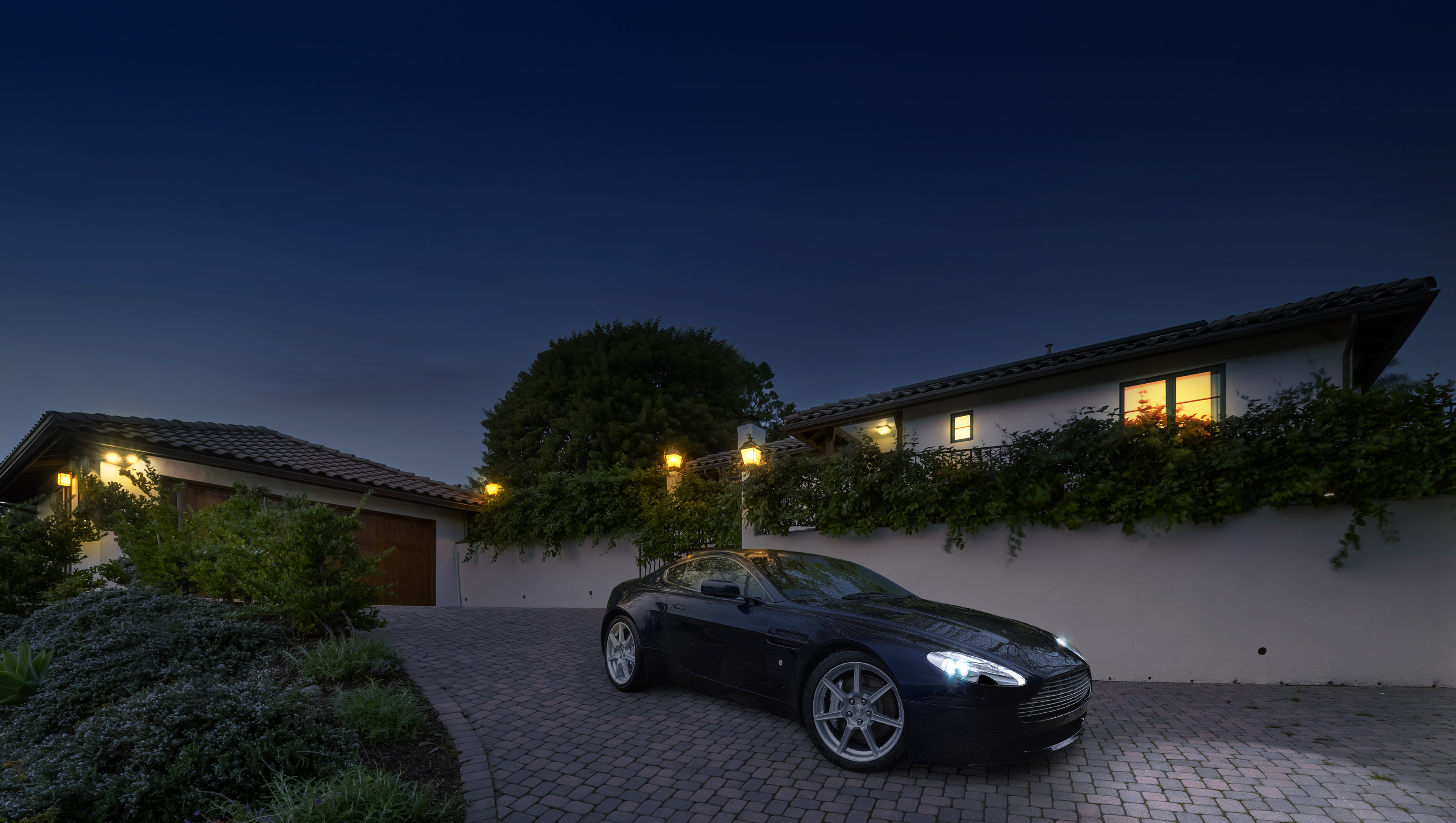hange the sky from daytime to twilight and turn on the house lights and car headlights.