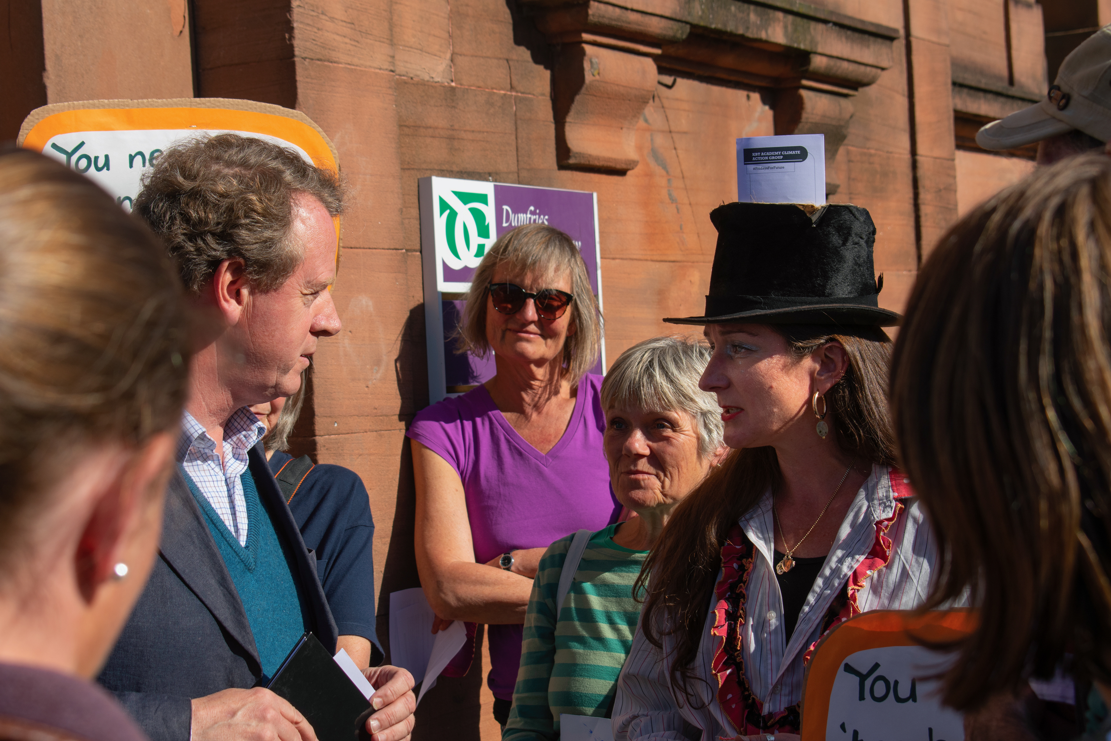 Alister Jack MP talking to protestors outside his surgery in Castle Douglas.