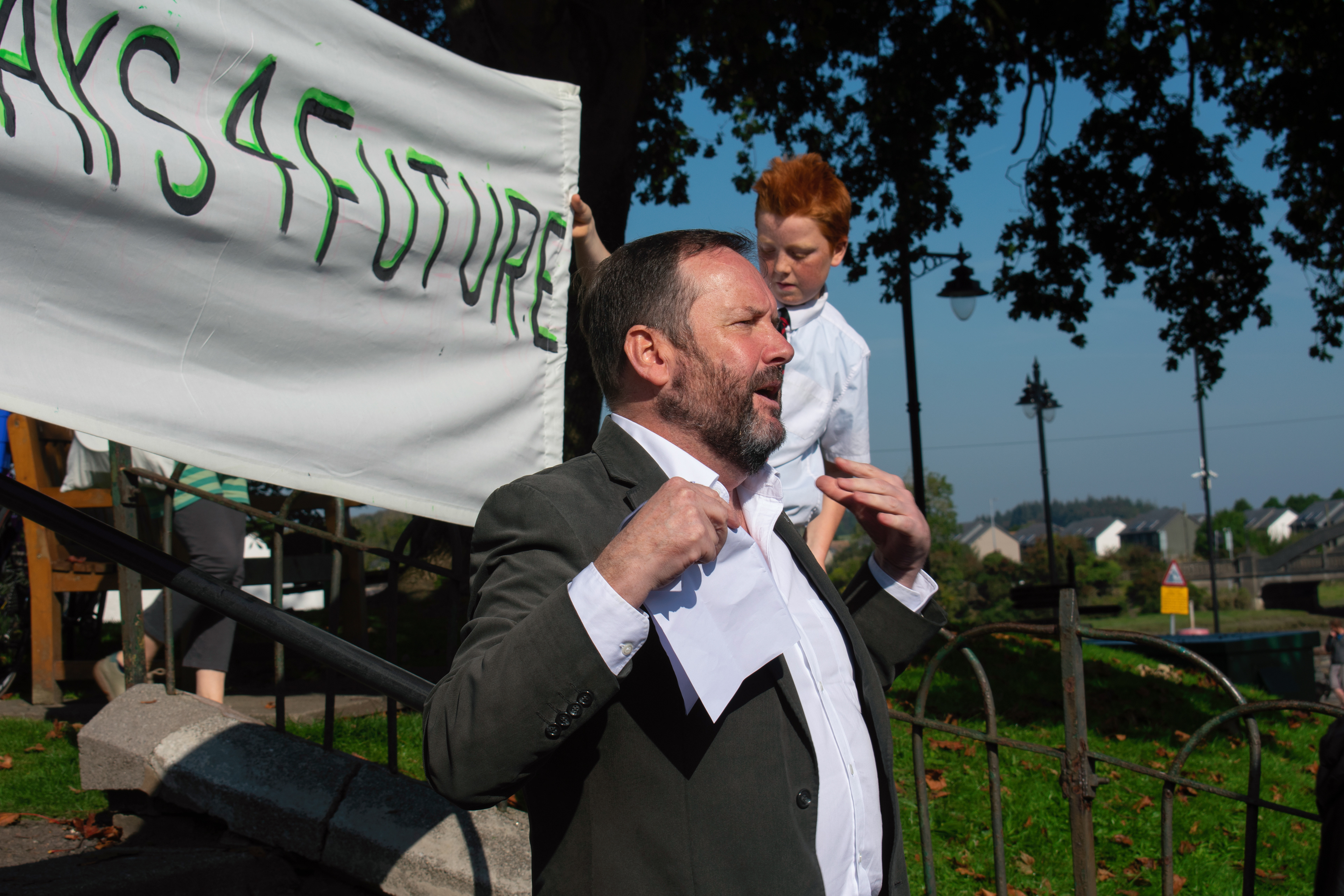 Councilor Dougie Campbell delivering a speech about climate change in the Harbour Square.