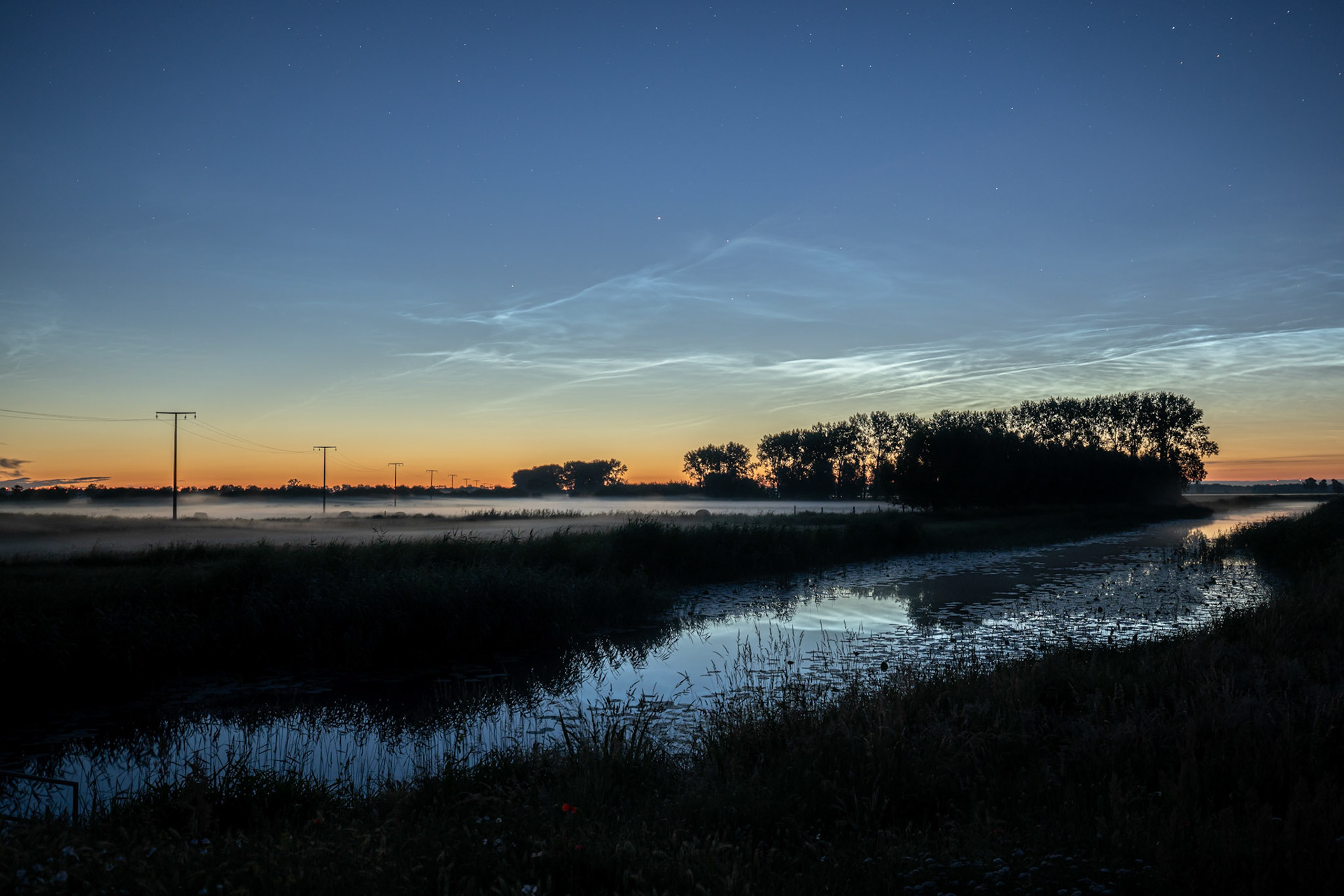 Shortest night of the year at summer solstice looking north. Sun is just a tiny bit behind horizon. Shot at 1.45am.