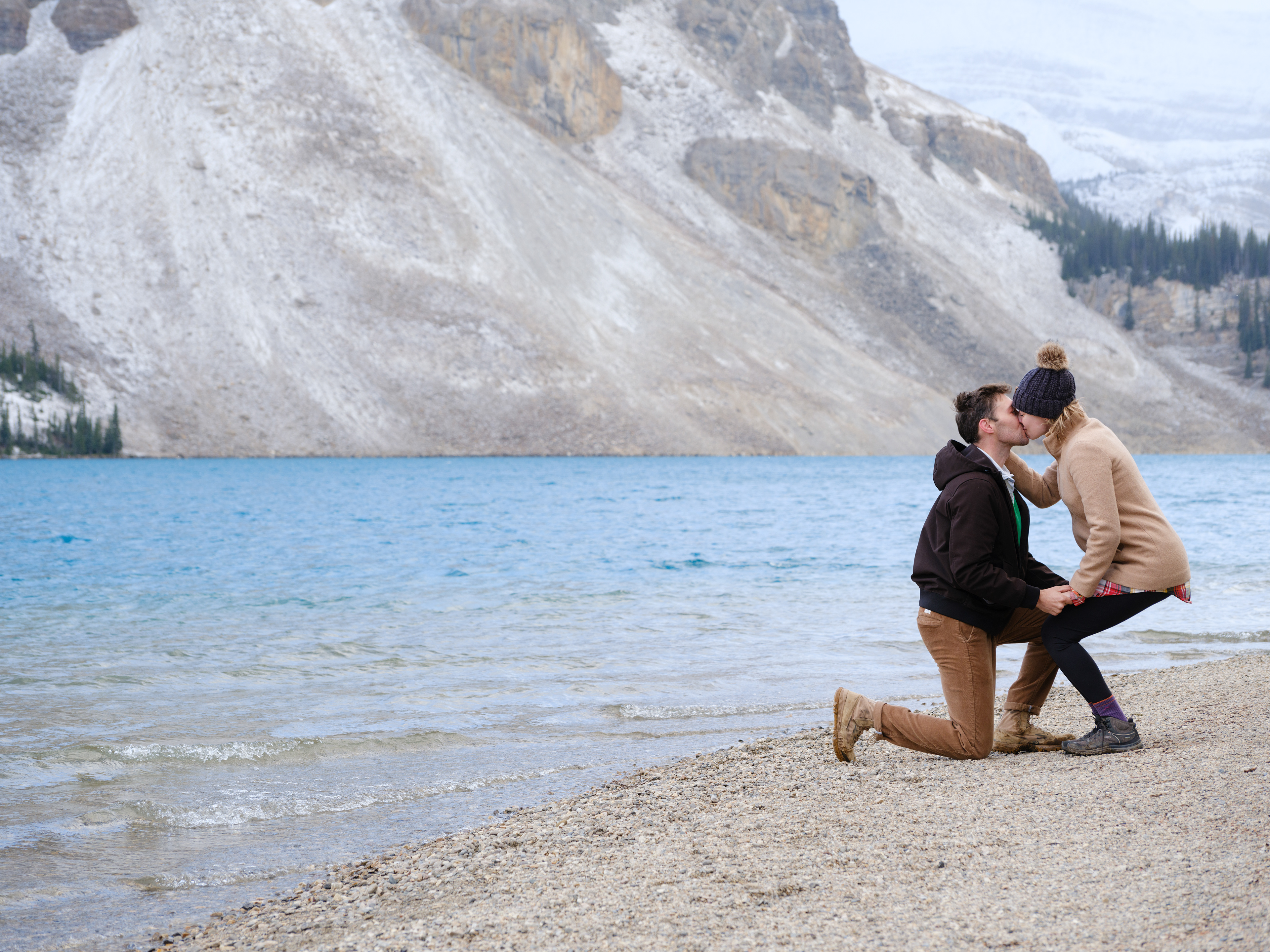 Proposal shoot in Banff and she said yes and they're kissing.