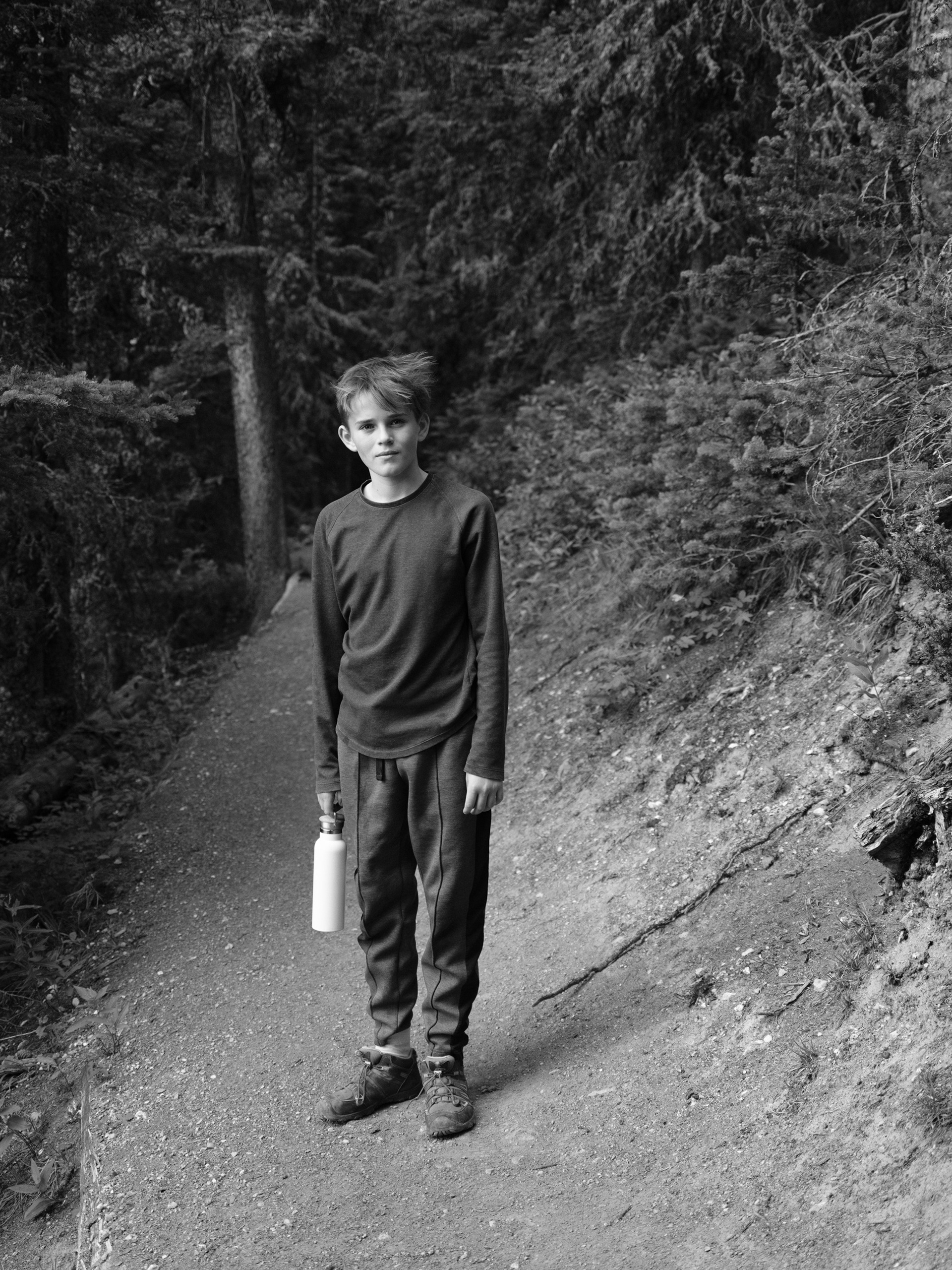 A pre-teen boy classically photographed for family to cherish for generations.