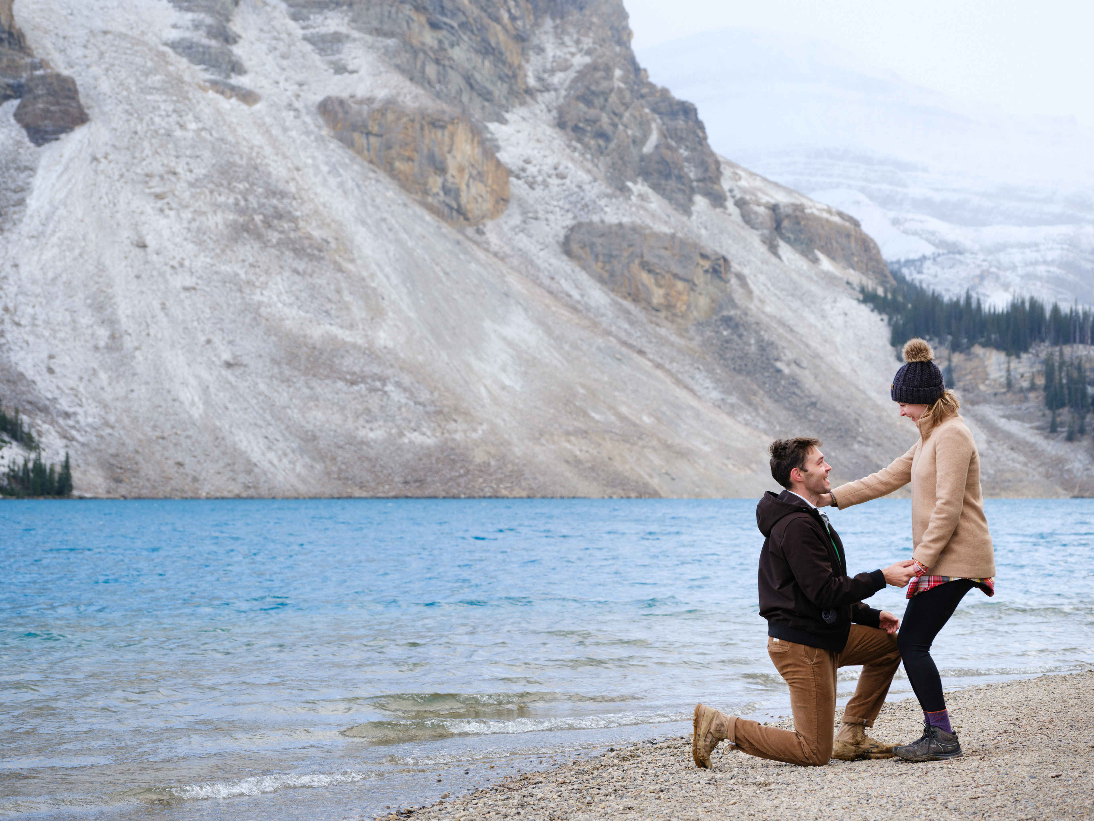 Joyous moments during a secret proposal photo shoot in Banff National Park