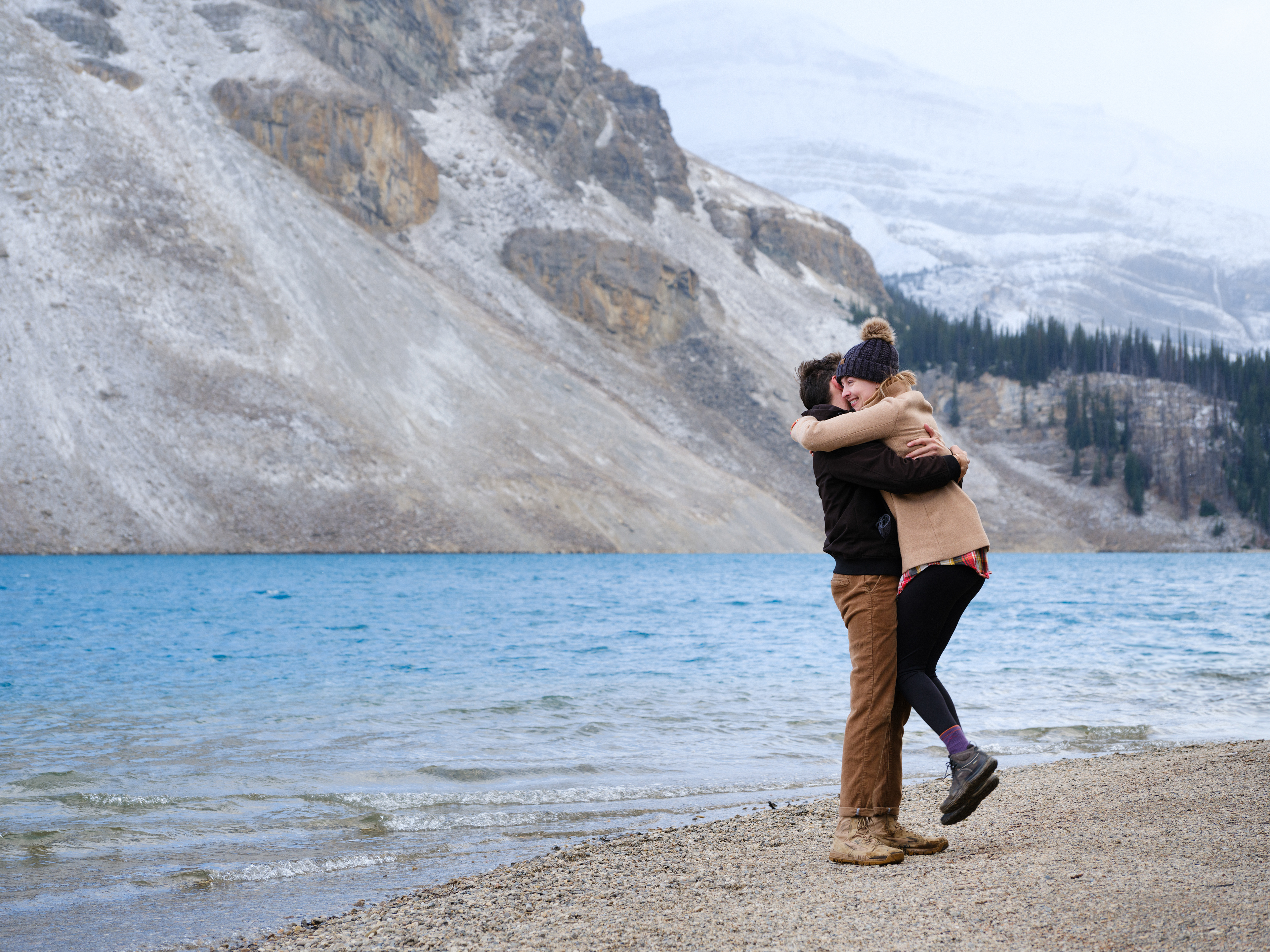 Engagement shoot in Banff and the couple are having an embrace.