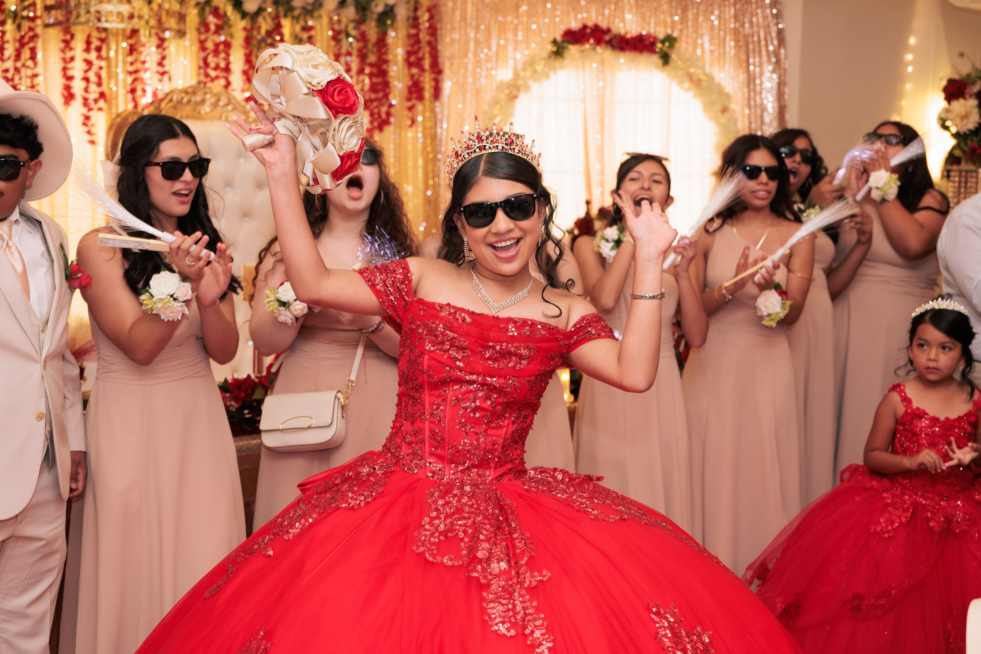 Excited Sweet 16 girl with sunglasses, celebrating with hands raised, featured on the reviews page.