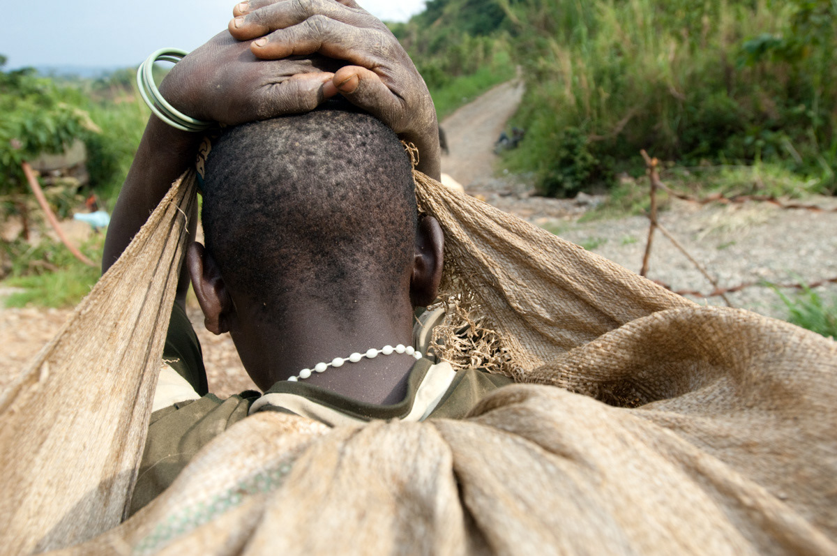 The impact on these womens' bodies of carrying such weights (at times up to 60 kgs) can be devastating. This young girl will carry these rocks over hilly terrain for more than two hours.