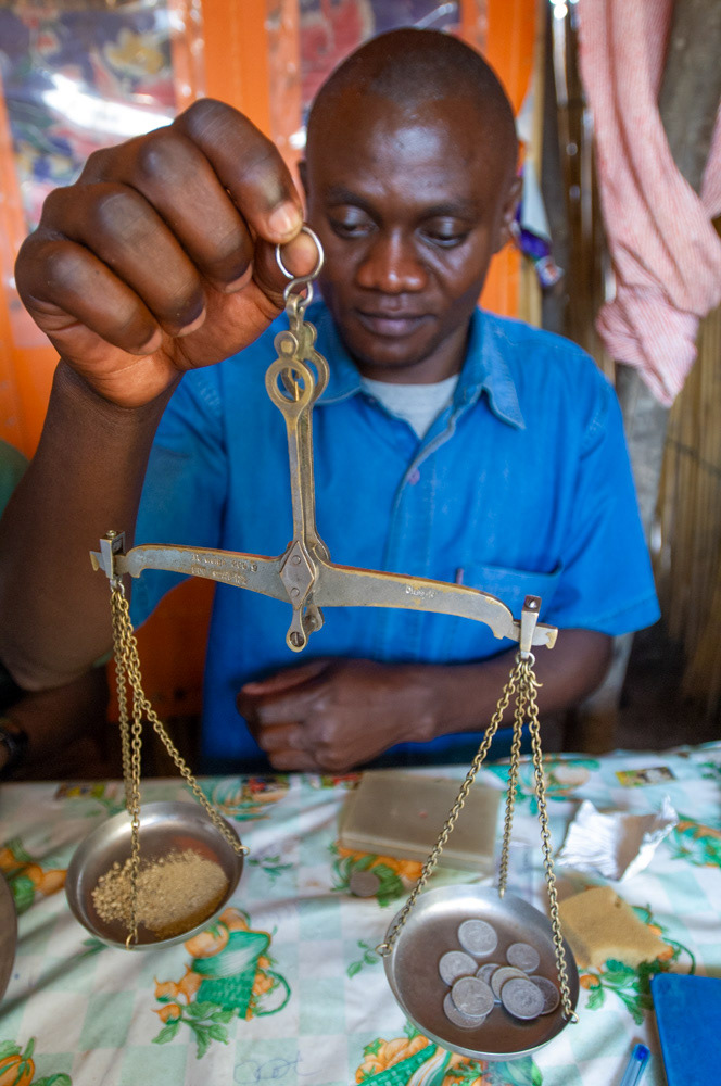 A man in Bunia, the capital of the Ituri district, weighs gold bought by an agent from Mongbwalu, three hours drive away.