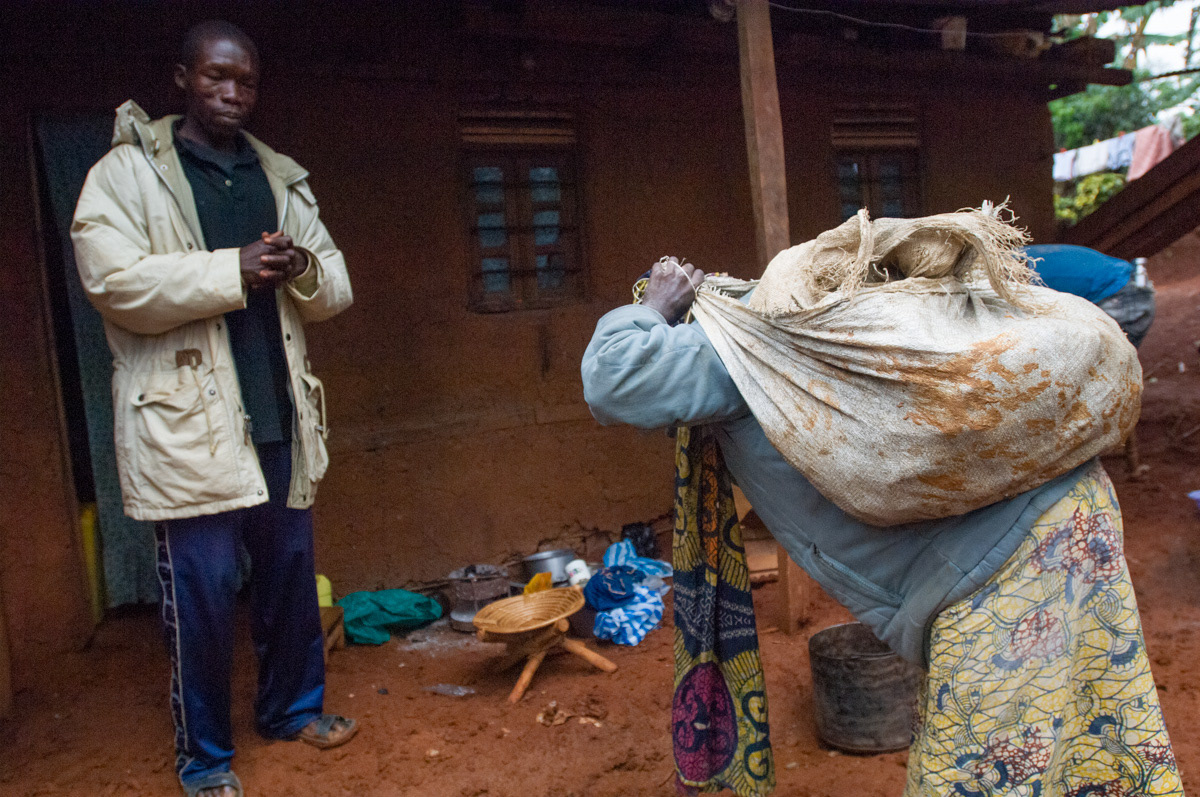 Dorica Biwaga, 25, finally arrives to deliver the rocks and receive payment for over seven hours of back breaking work, crawling, trekking and hauling of more than 30 kgs of rocks from the goldmine.