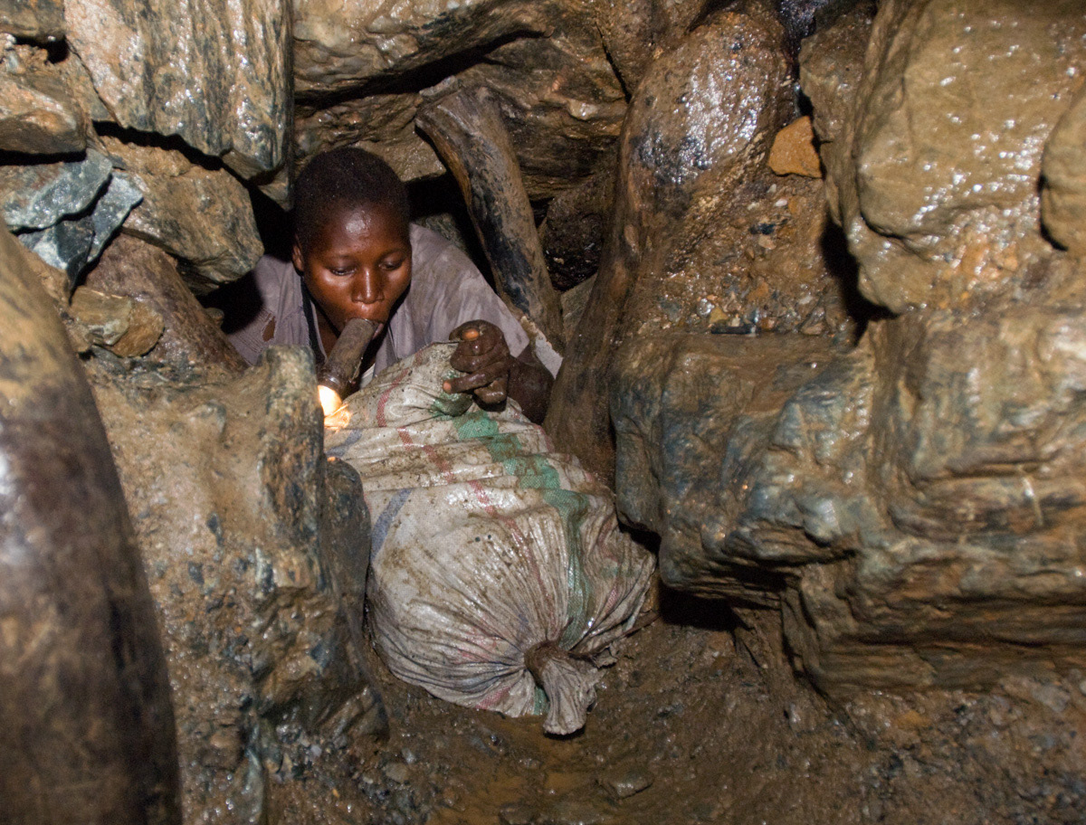 Lotsove Aduba, 27, a widow, pushes up to 60 kgs of rocks through a narrow tunnel inside Senzere mine. “Sometimes we feel dizzy because of a lack of food. I was carrying when I was pregnant. I carried until I was one month from delivery. I was crawling on my stomach, I felt backache, waistache, but I delivered without a problem.”