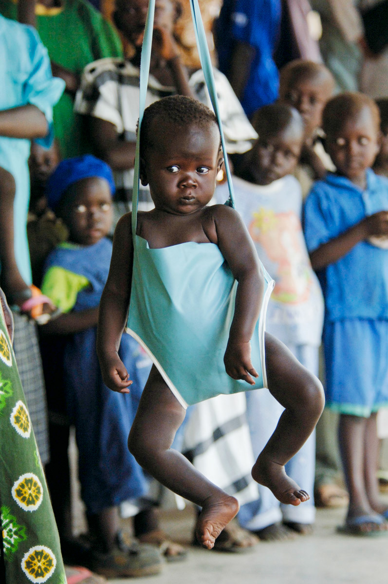 A young child is weighed at a health centre in Juba, Southern Sudan.