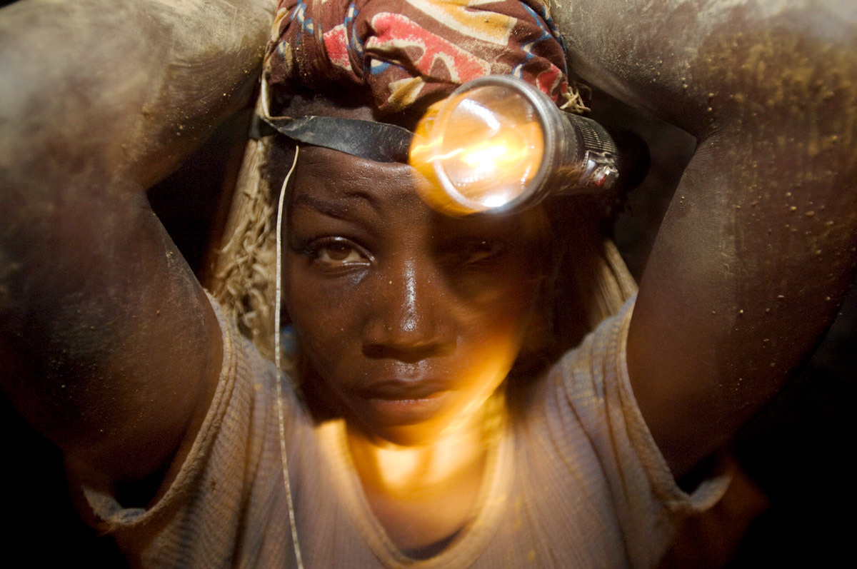A young girl carries around 40kgs of rocks out of Adidi gold mine in Eastern DRC. (See the STORIES for the full feature.)