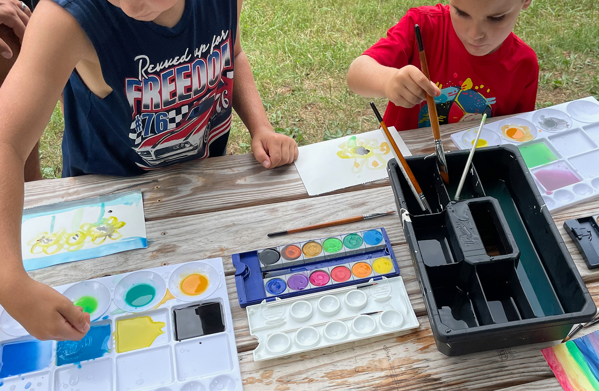 Boys painting sunflowers at Sunflower Fest 2023!