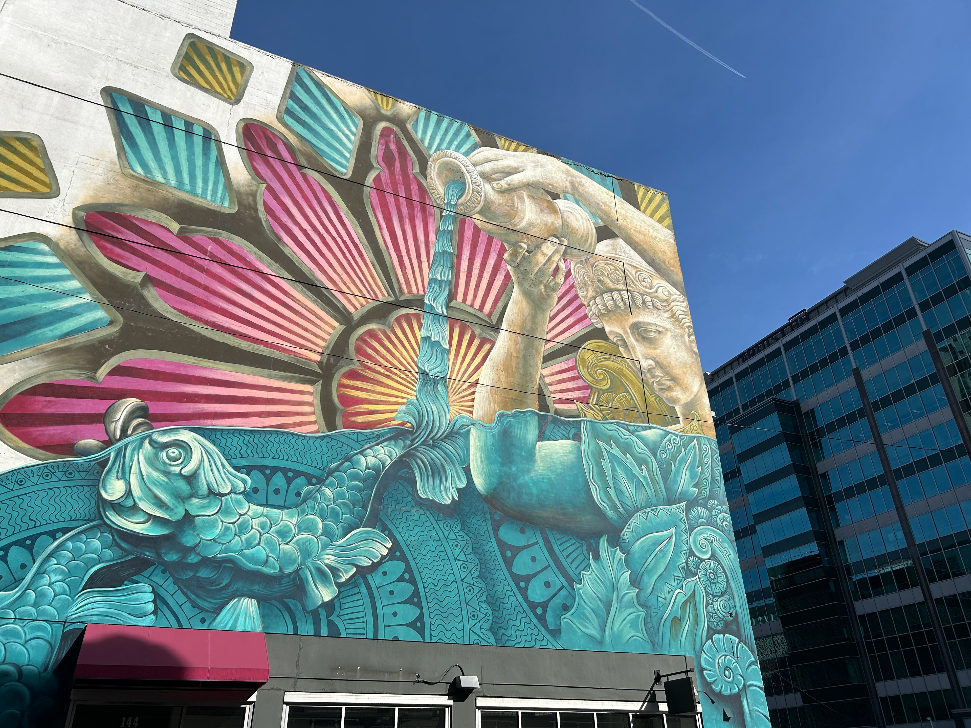 A mural on the side of a building near Broadway.