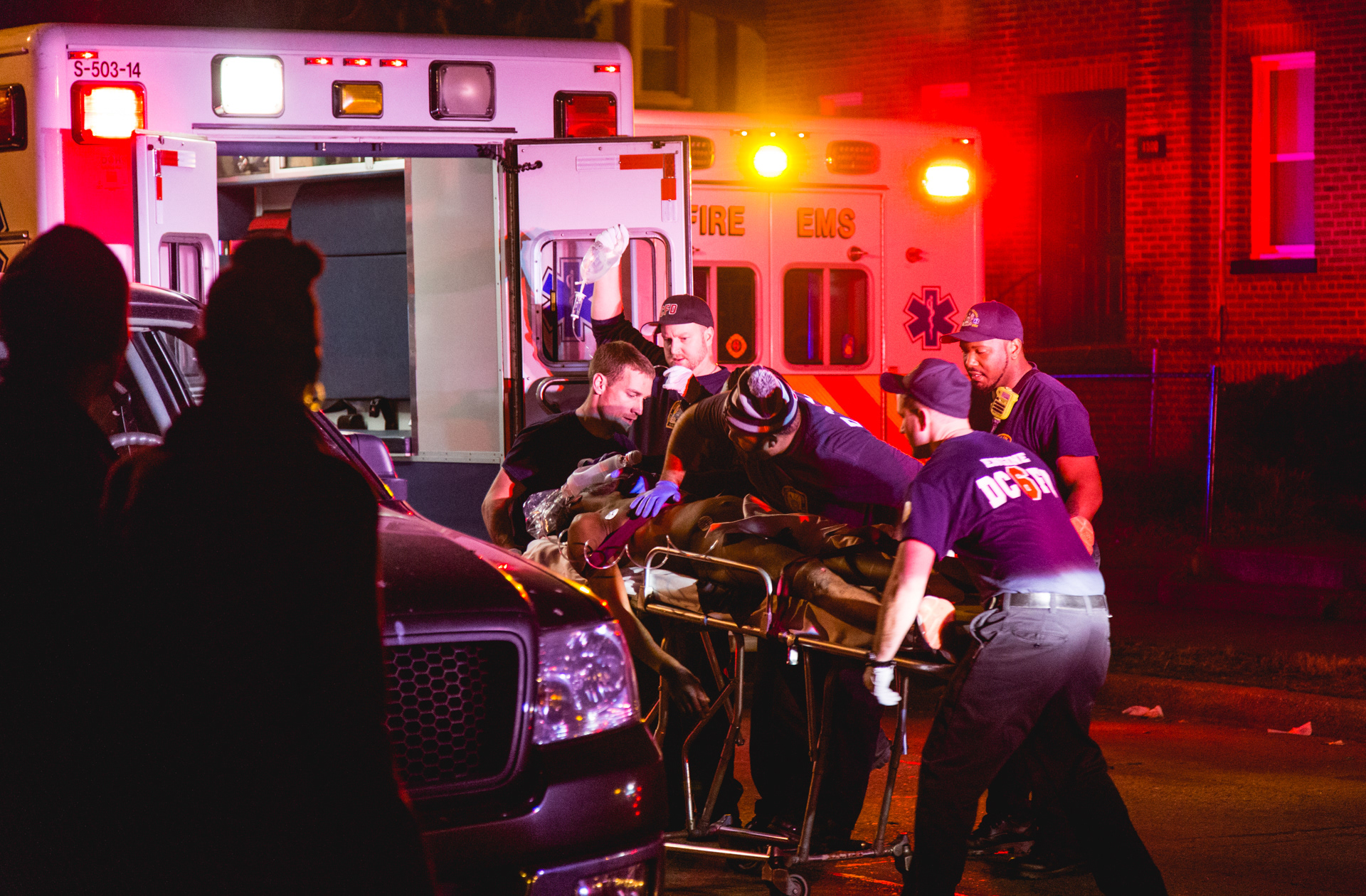 suspect loaded into ambulance . 2017