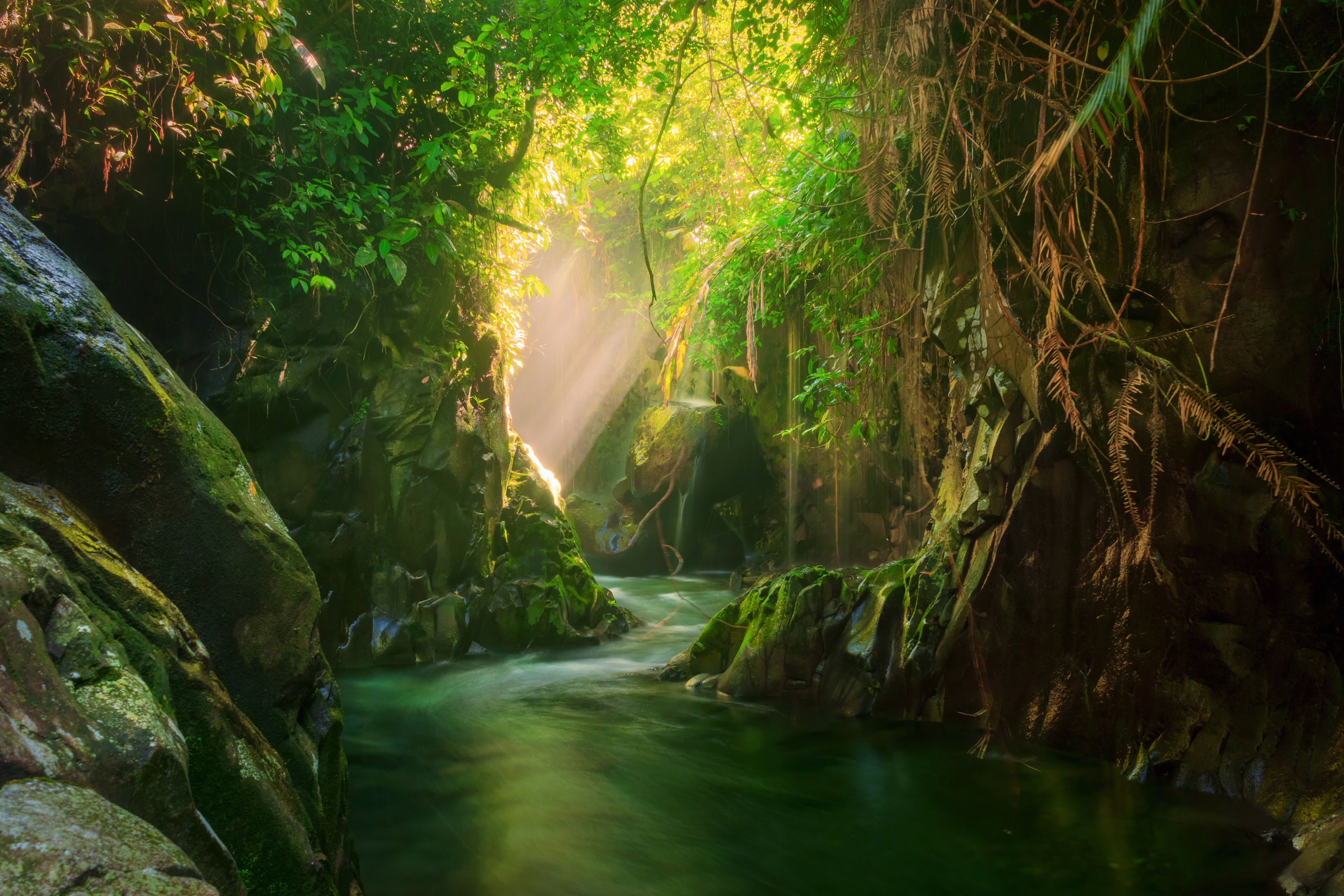 Beautiful morning view at the stone tunnel waterfall in Indonesia's tropical forest, this Location in Lorong watu in Kemumu Village