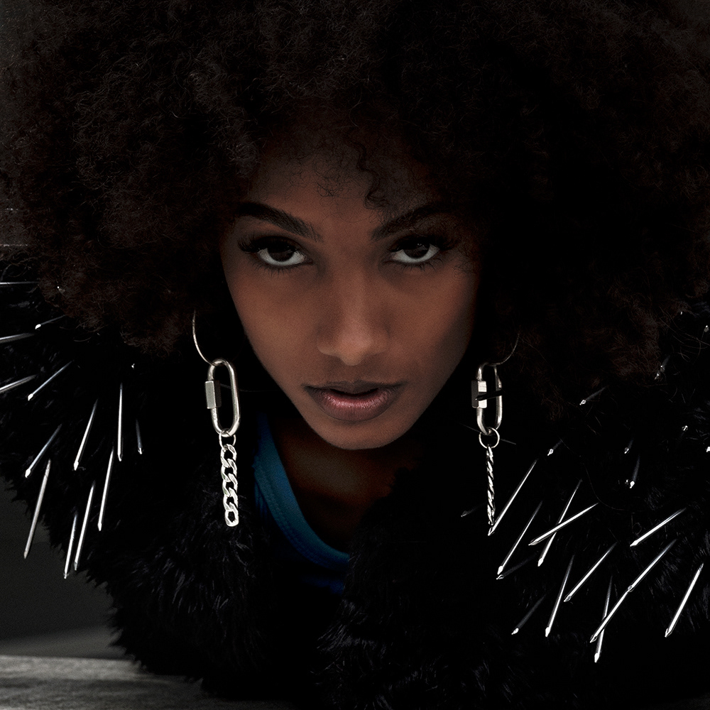 Portrait by Baptiste Janin, featuring fashion campaign for YVY leather and Maniega, with models wearing high heels, fur, and metal accessories. Photo taken in Geneva, Switzerland, using medium format Fujifilm. 2023.