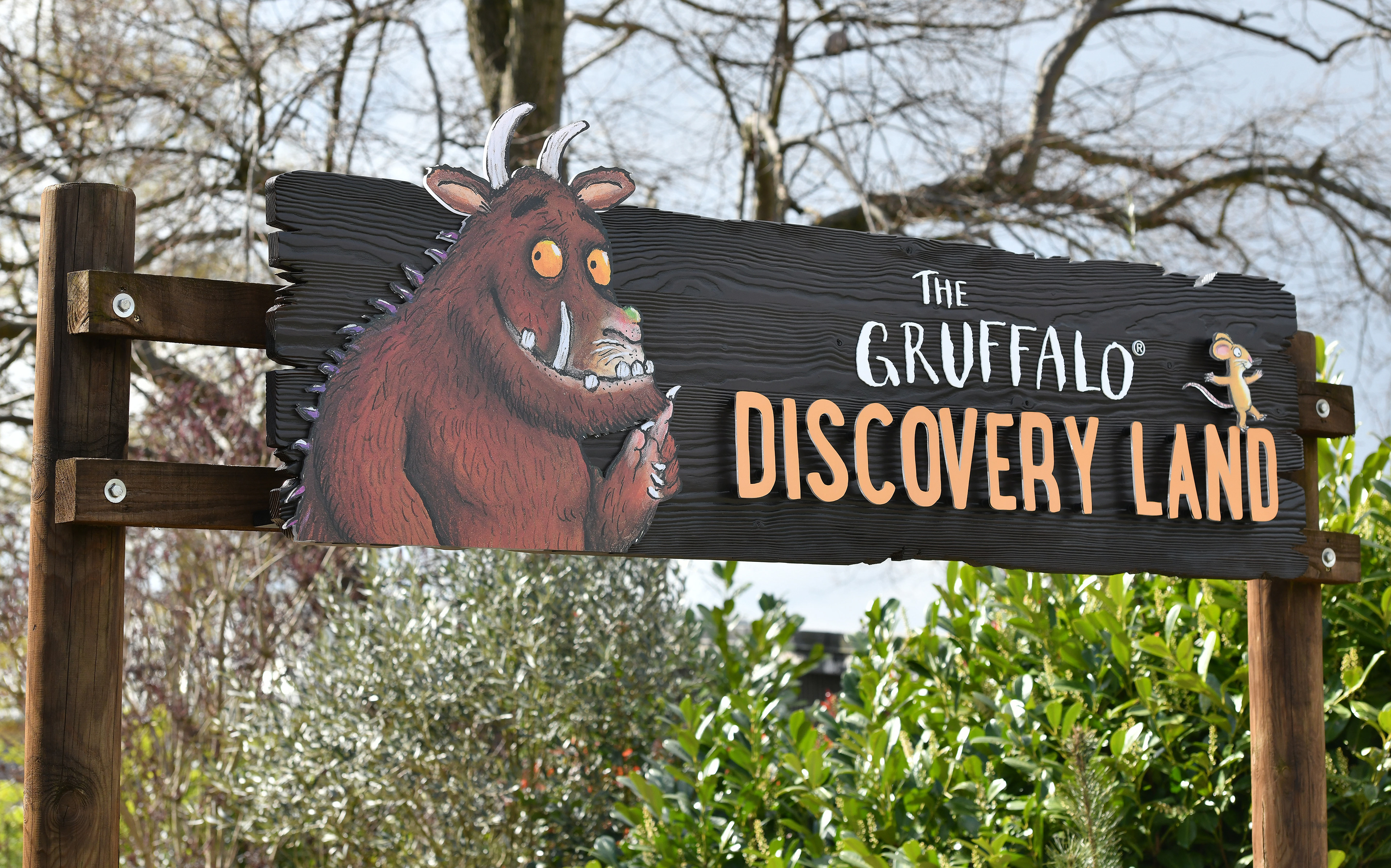 Main Entrance Signage - Backboard finished in Douglas fir with pop out elements cut out in acrylic