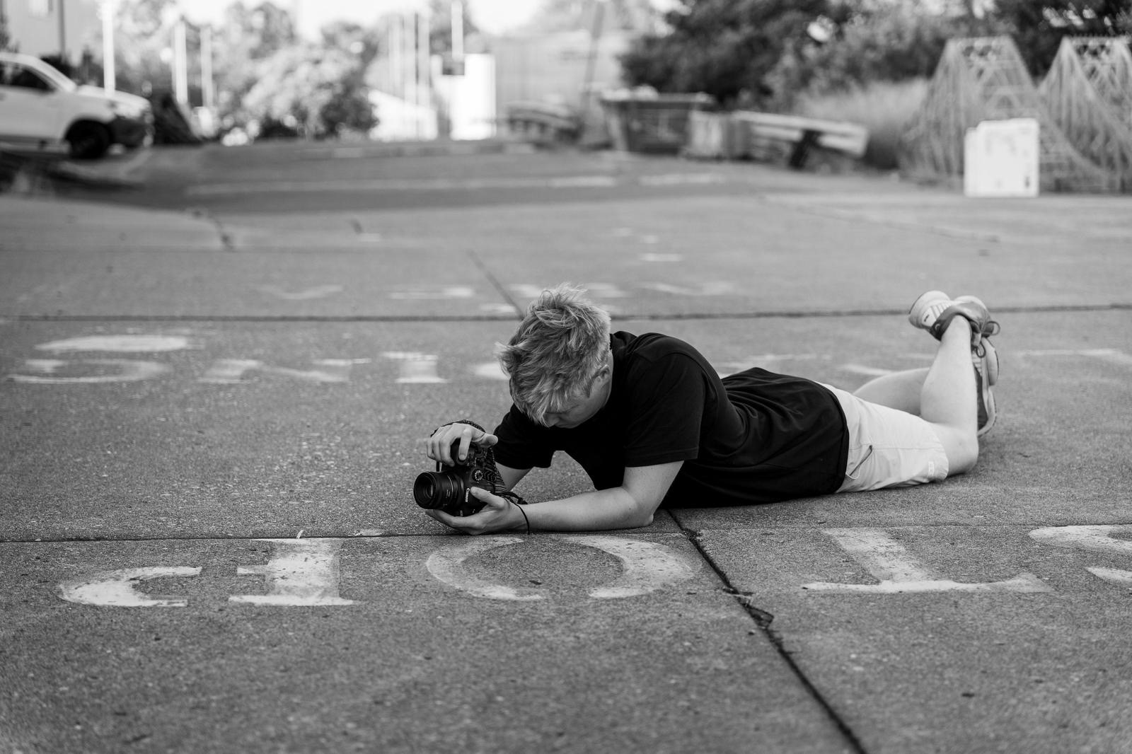 Josquared_Photography looking for the best angles for a street sports photography shoot