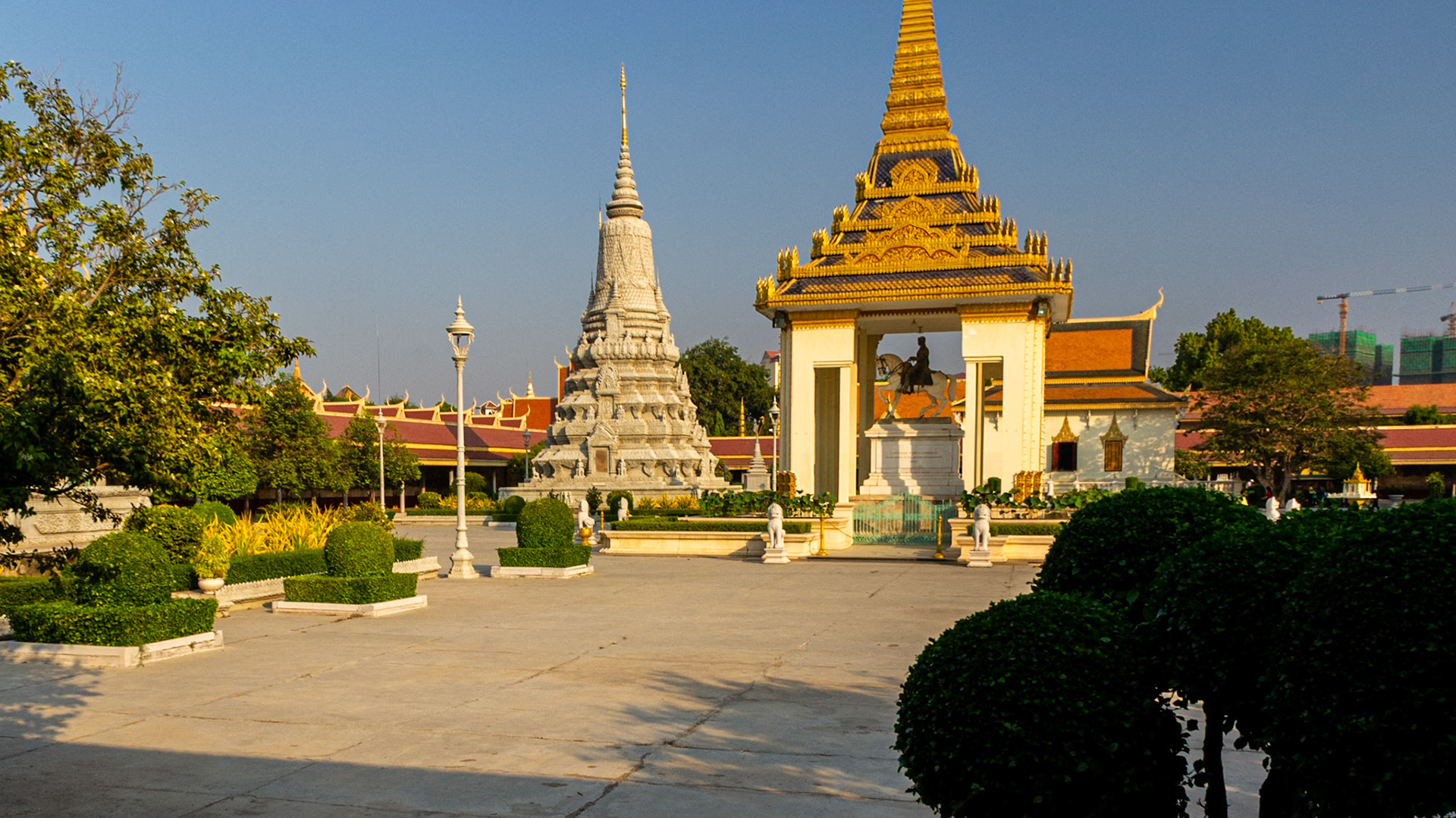 Royal Palace courtyard with statue of King Norodom and his Stupa in the background.
