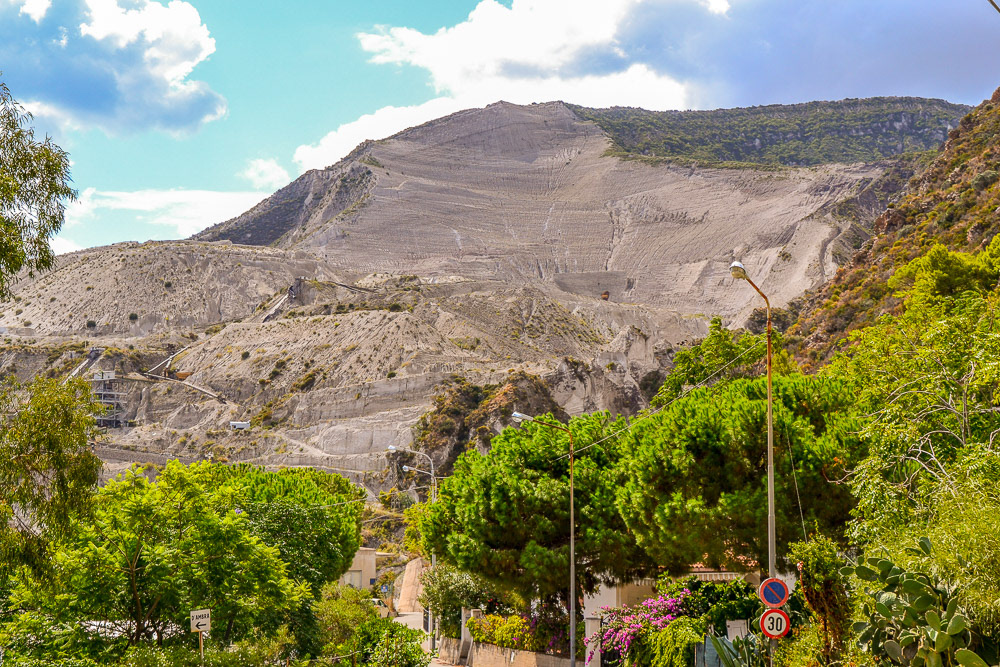 Porticello - cave di pomice. The scarred face of a pumice stone mine.
