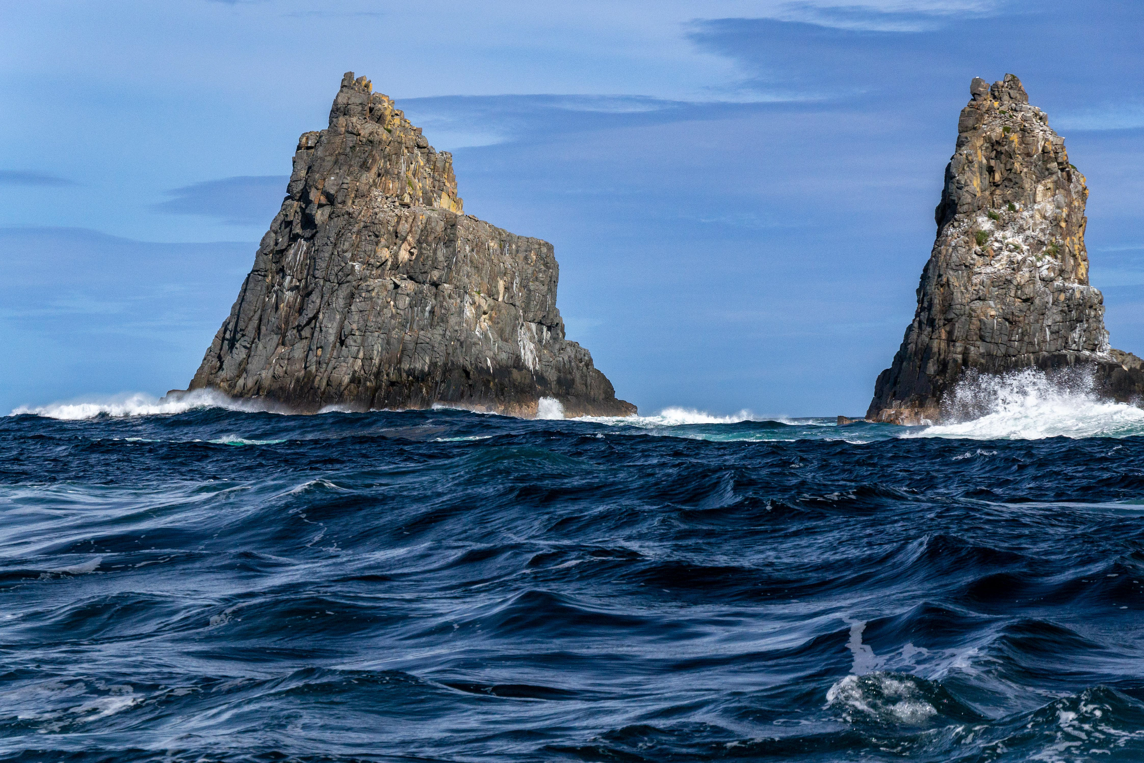 Pillars of rock rise from the ocean depths.
