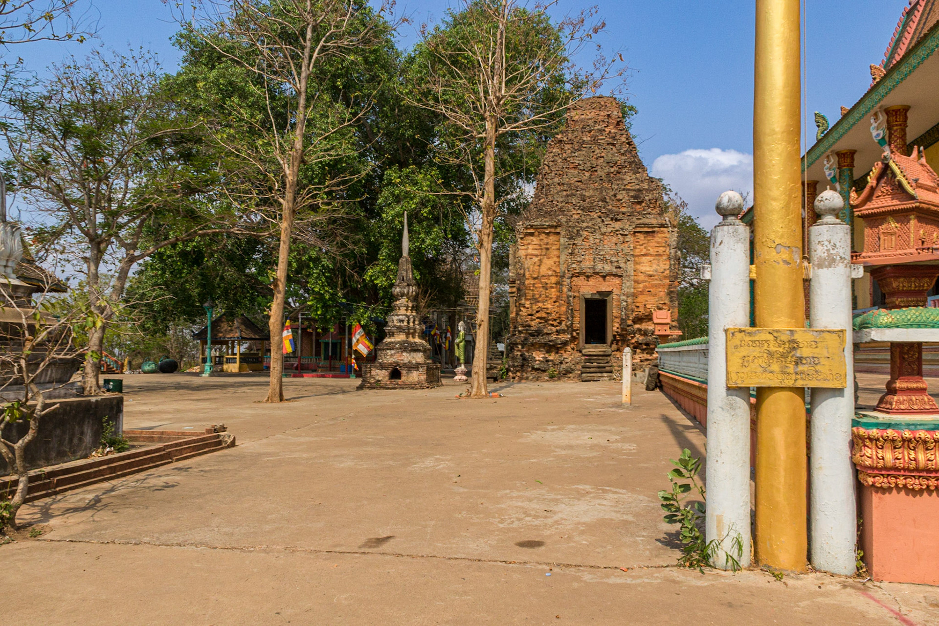 This weather-worn red brick structure was once an ancient temple dedicated to Hirahara, a Hindu god. It stands beside other temples worshiping Buddha.