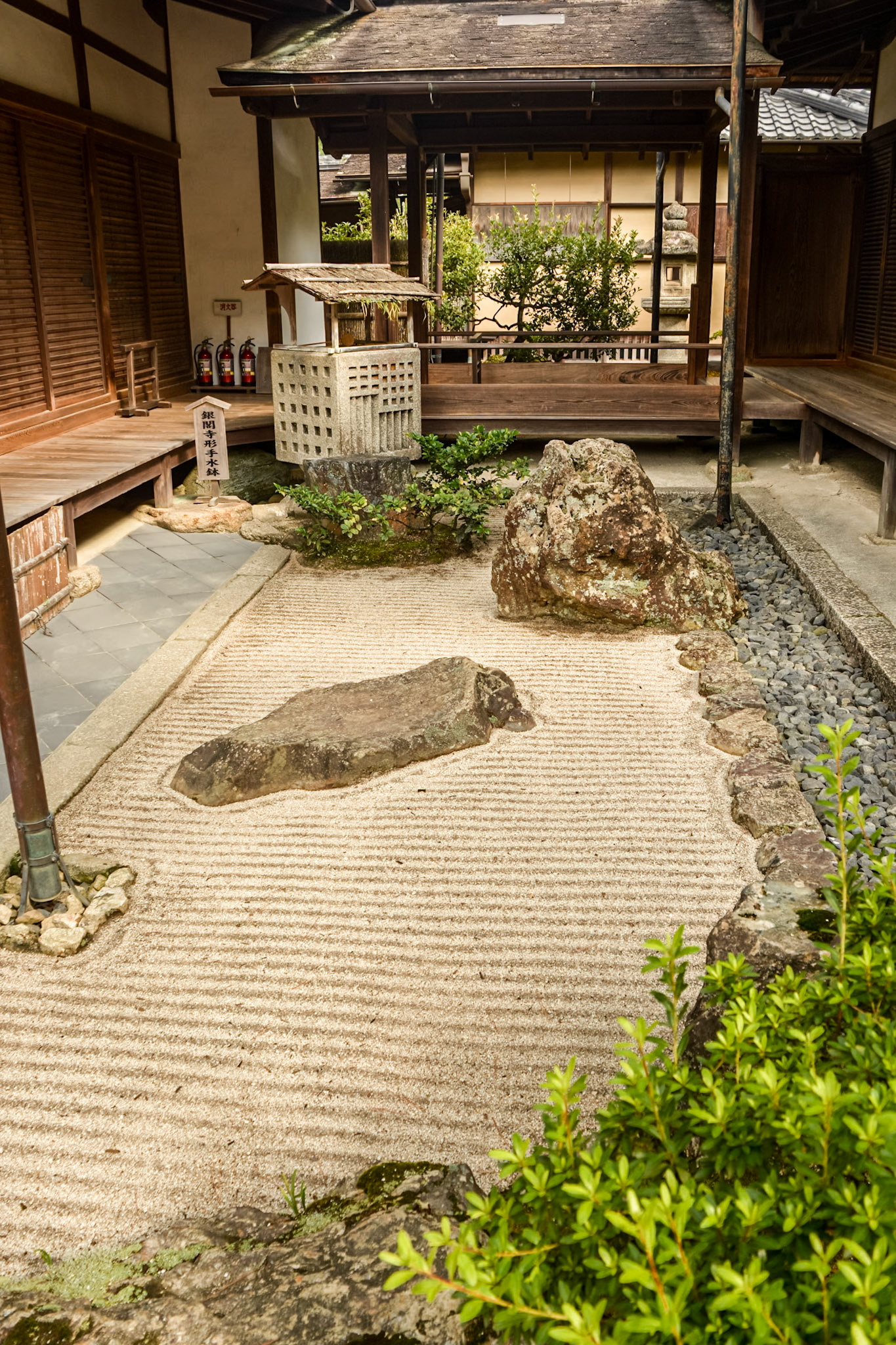 Carefully tended sand gardens are nestled between buildings.