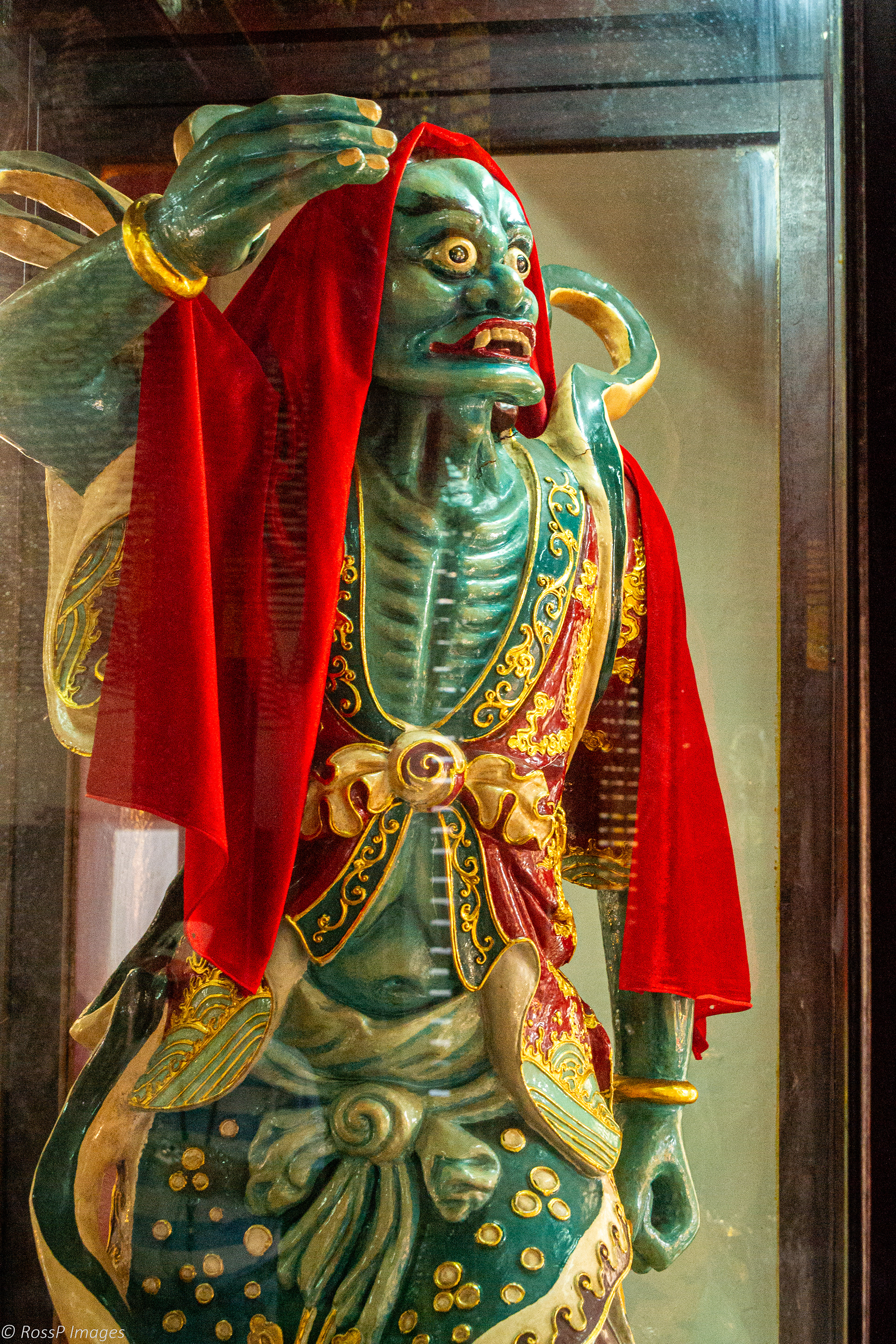 Either side of Lady Buddah statue stand guardians one who has the holy ears and the other has the holy eyes.