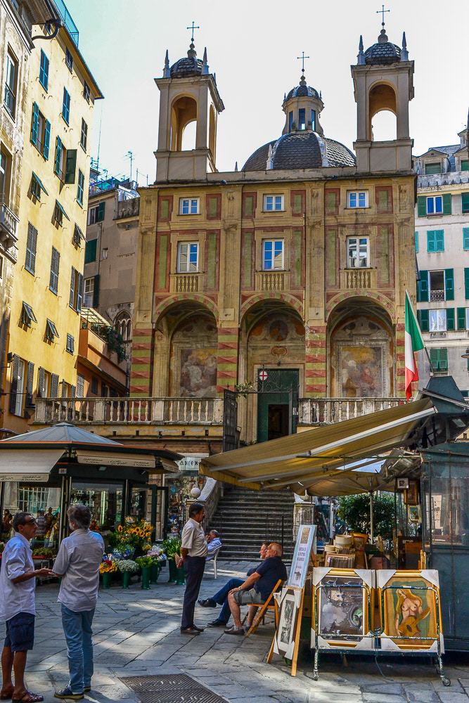 The leisurely pace of piazza life in Genoa.