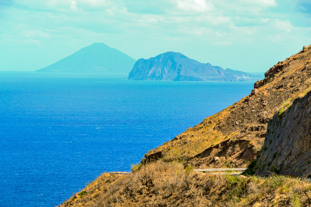 Aeolian Islands fade into the hase off the coast of Lipari. Panarea with Stromboli behind.