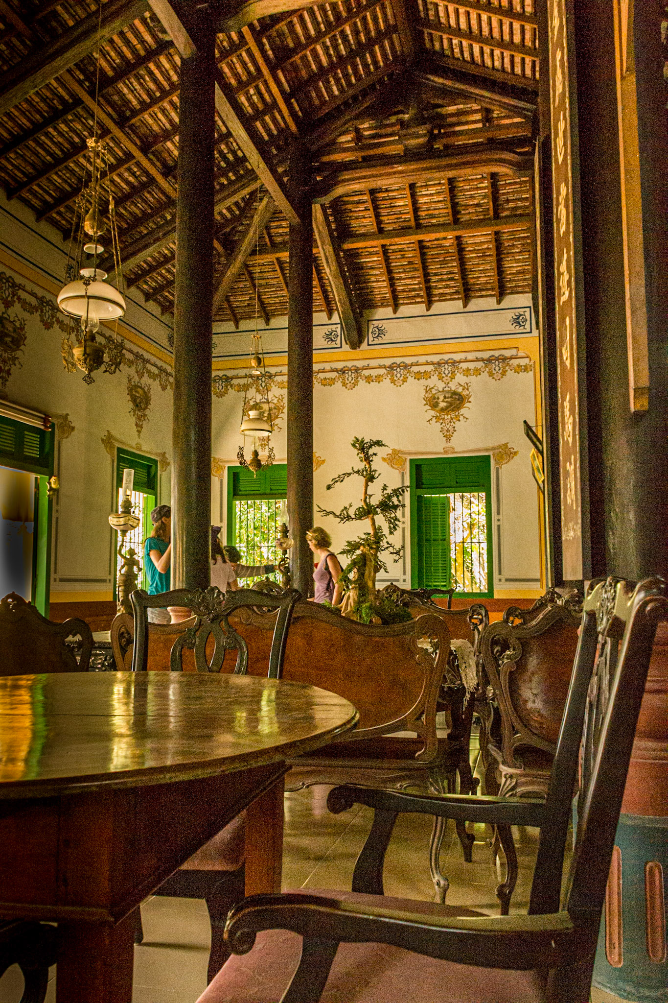 The interior retains the rustic feeling of Vietnamese wooden interior.