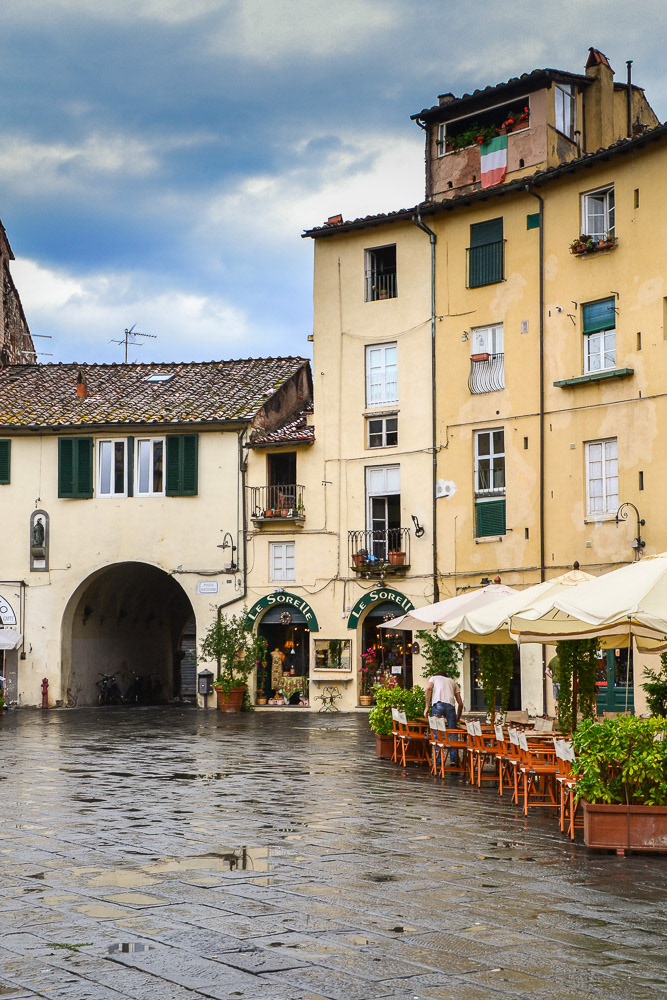 Piazza Anfiteatro is almost deserted after a heavy downpour.......