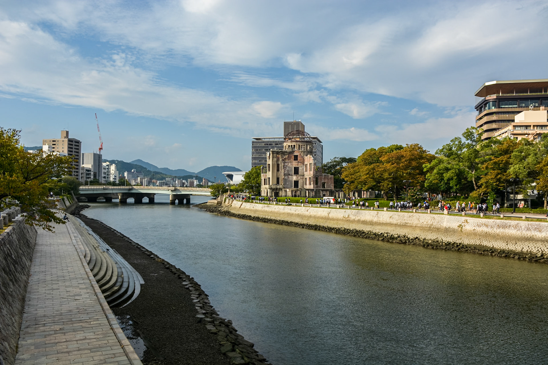 Hiroshima Peace Tower (Genbaku Dome) on the bank of the Ota River and the Aioi bridge behind.