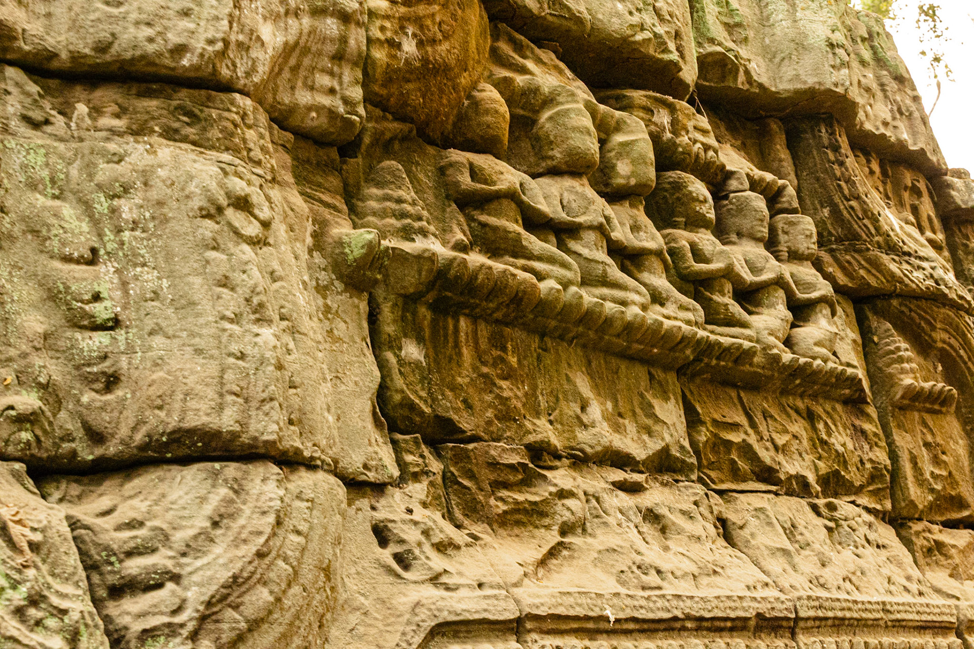 Carved figurines in the sandstone blockwork.