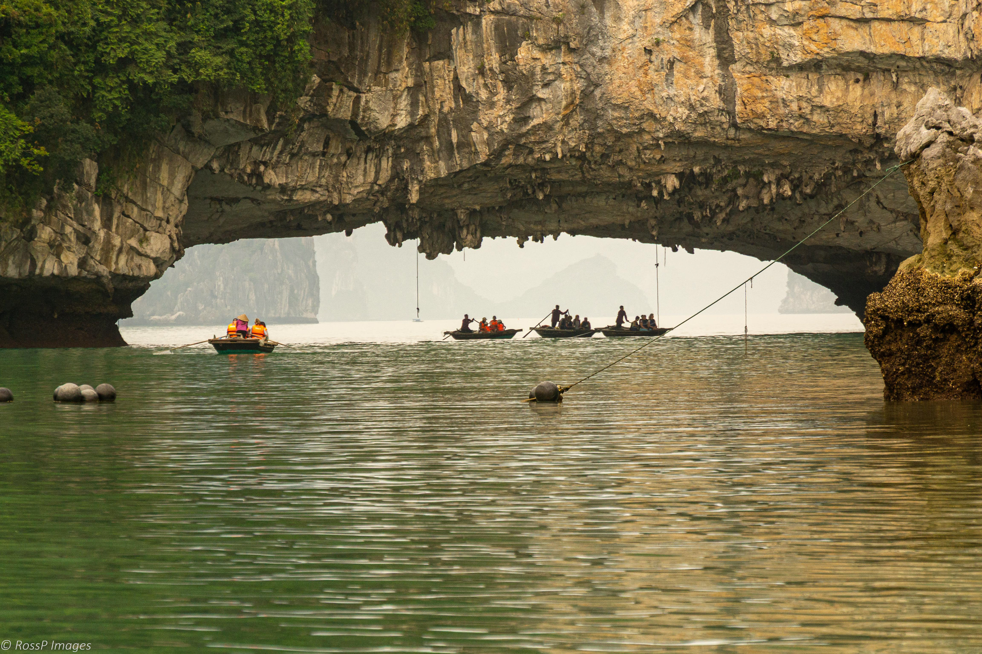 Exploring the natural wonders of the surrounding islands and arched openings by bay-style water taxi.