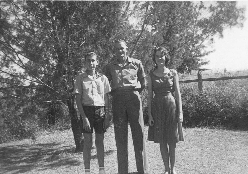 Ed with Lorraine and Ross in the backyard.