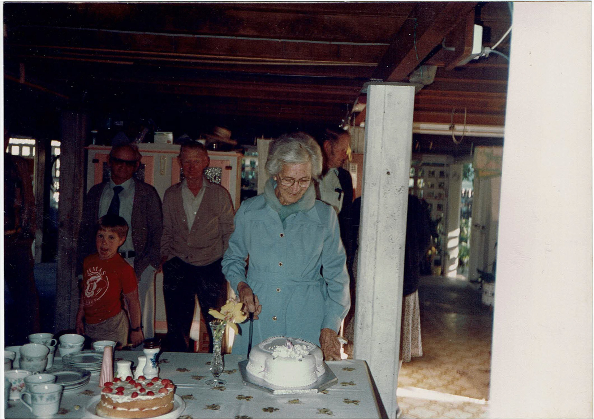 Marie cutting her cake on her 90th Birthday.