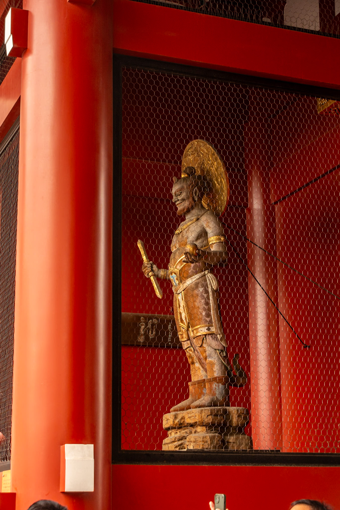 Buddhist god Tenryū on the east side at the rear of the Kaminarimon gate.