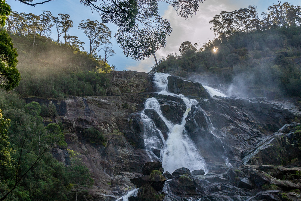 Mist rising from cascading water of St Columbia Falls is accentuated by the afternoon sun.