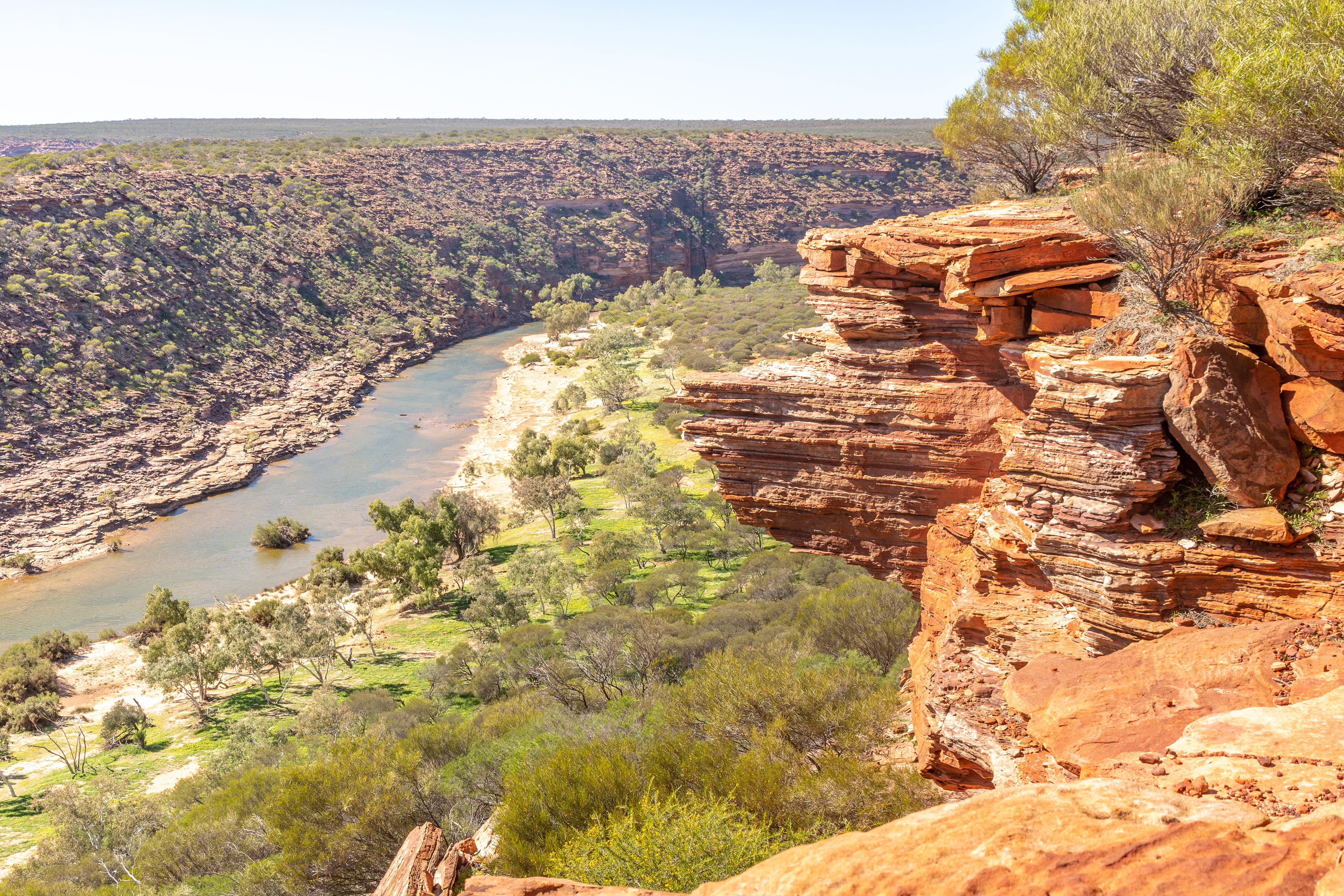 Spectacular rock outcrops frame the view over the Murchison River