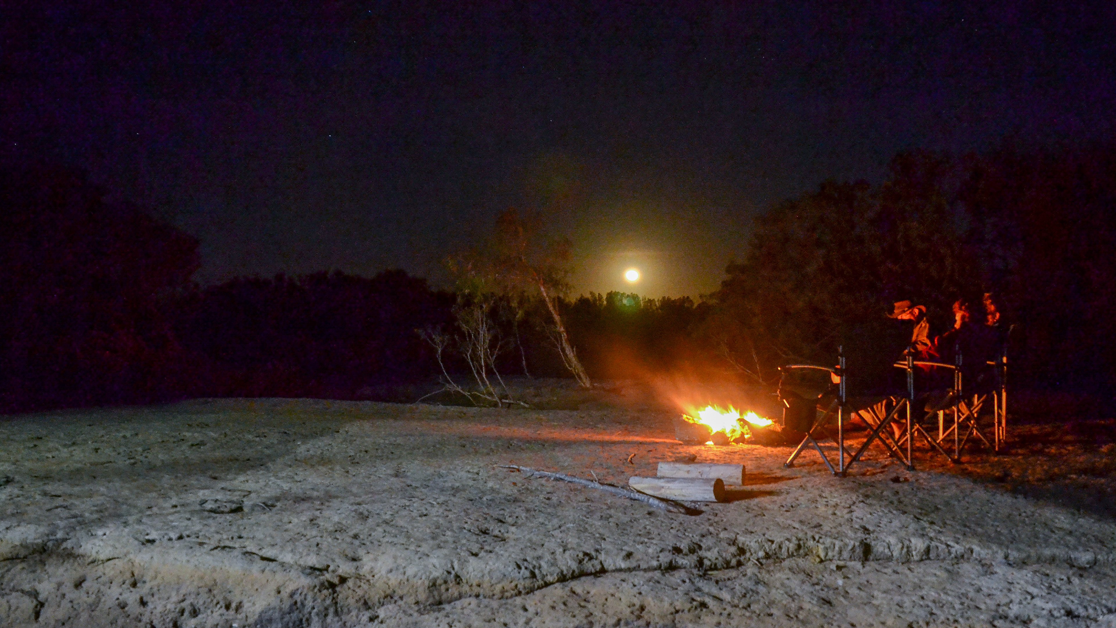 Beside our campfire with a full moon rising above the Leichhardt River.